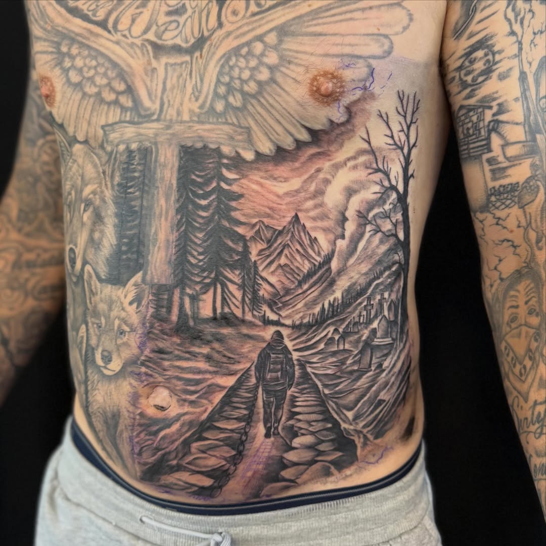 Landscape with journeyman realism tattoo on the torso by Jordan Clifford