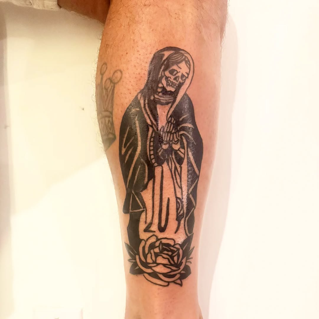 Grim reaper with rose dark art tattoo on the calf by Miami Beach Tattoo Artist