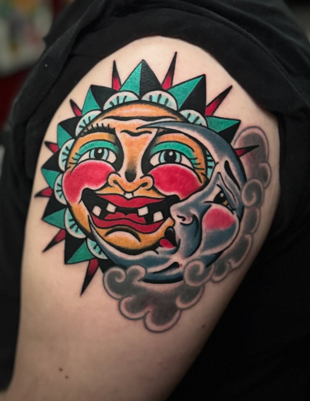 Sun and moon faces American traditional tattoo on the shoulder by Bre