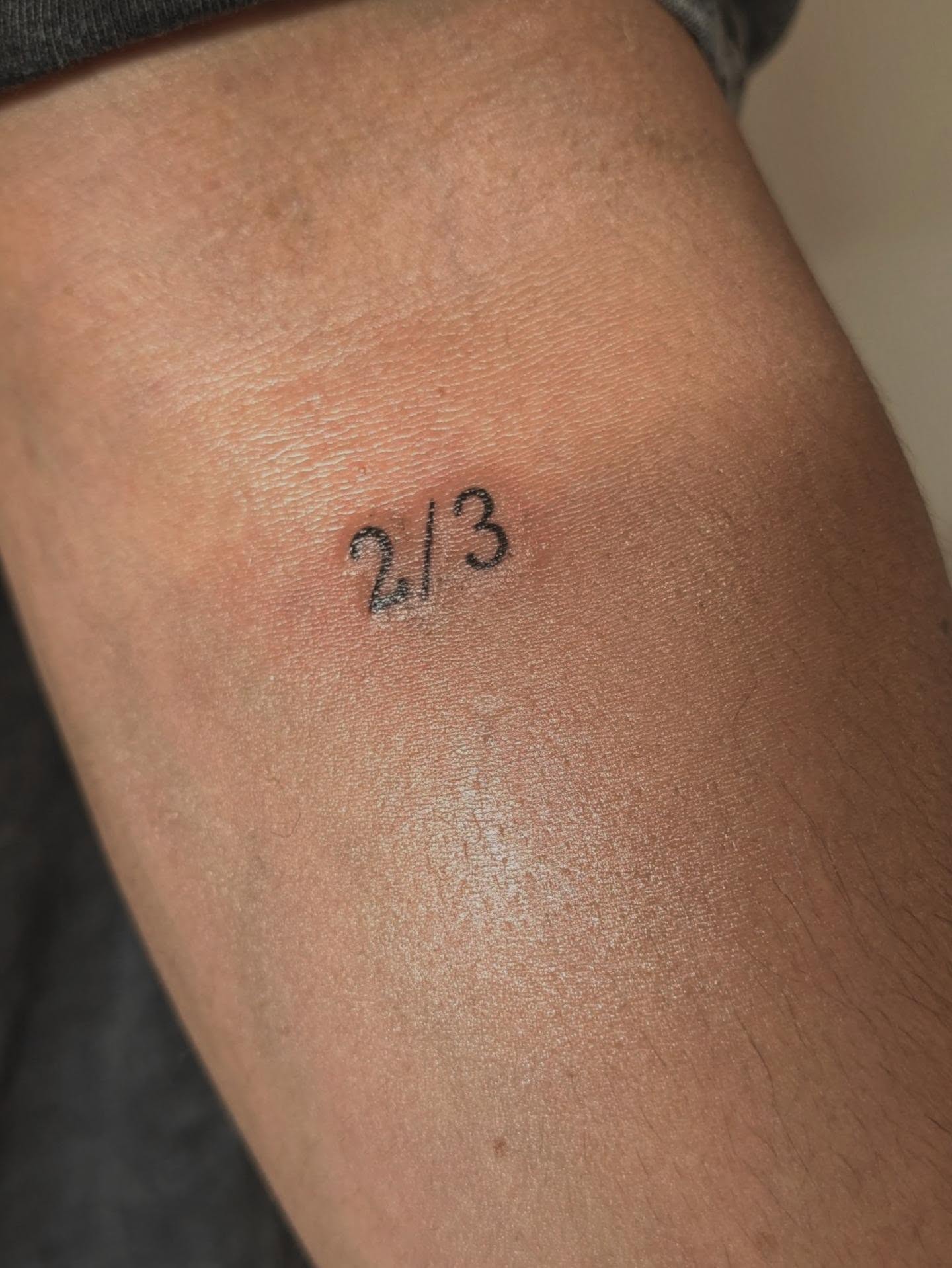 Mathematical fraction lettering script tattoo on the thigh by Tony