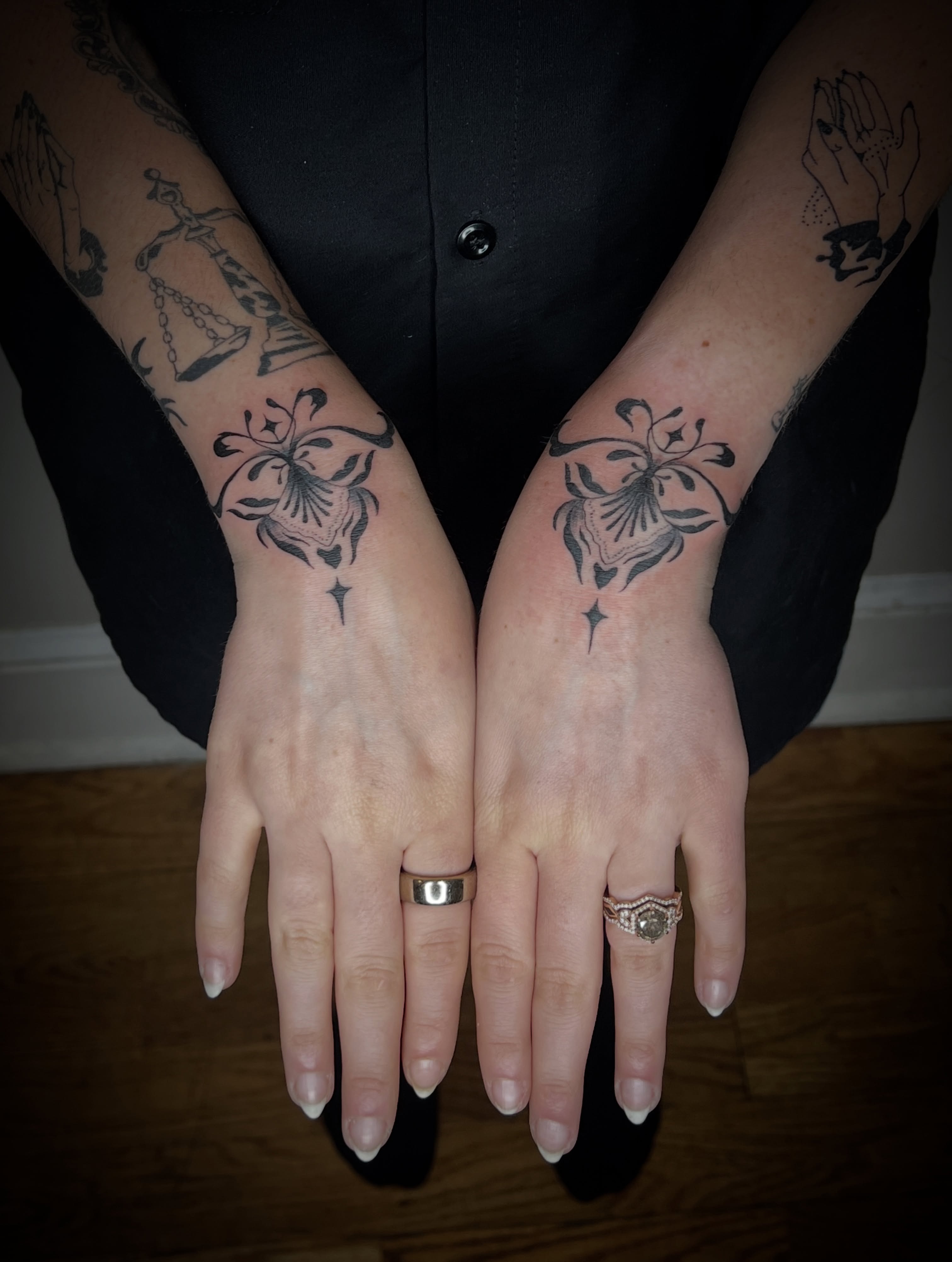 Lily black and grey tattoo on the forearm by Elleree (LRE)