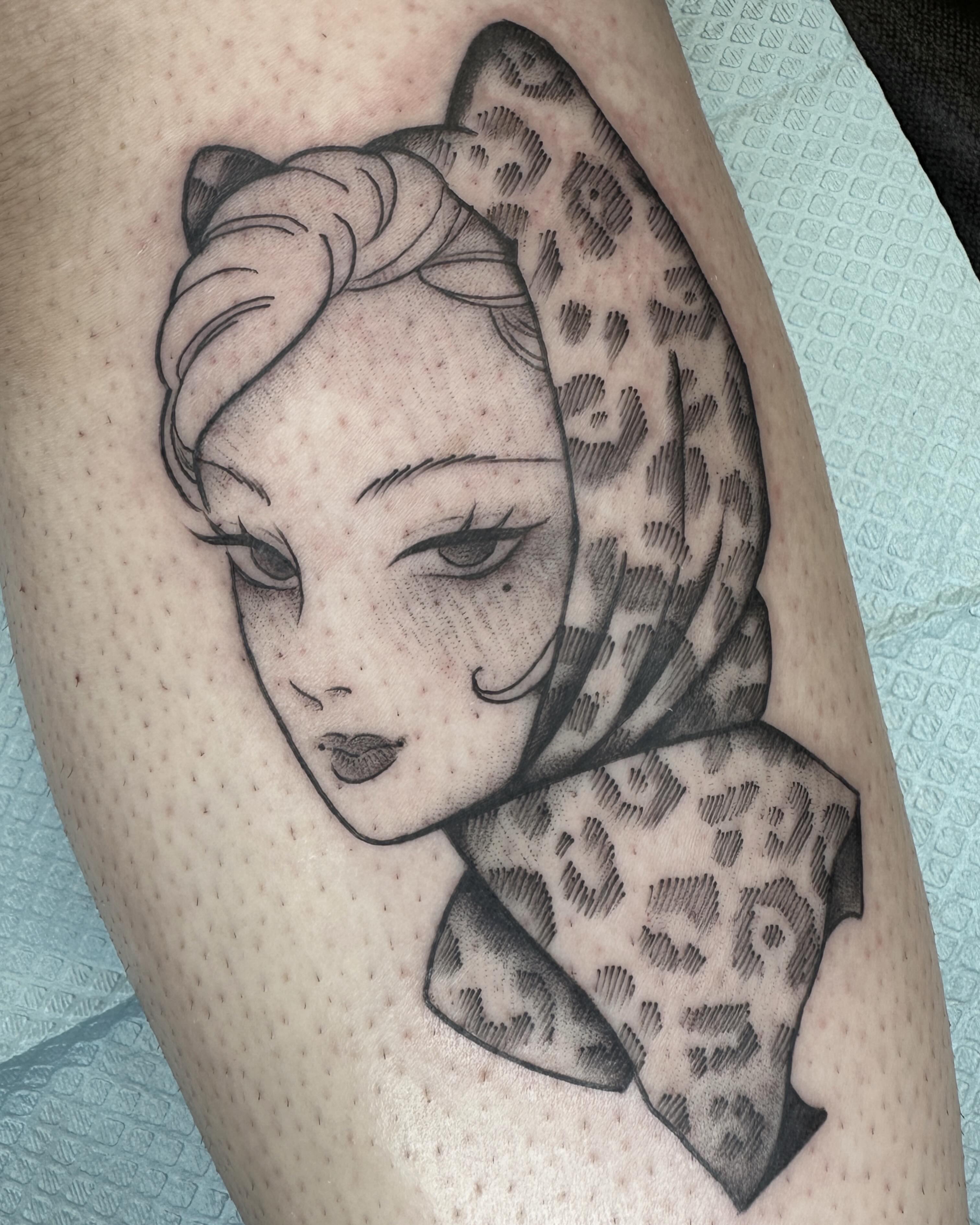 Woman with leopard print scarf dotwork tattoo on the forearm by Amelia Rose, Los Angeles, California