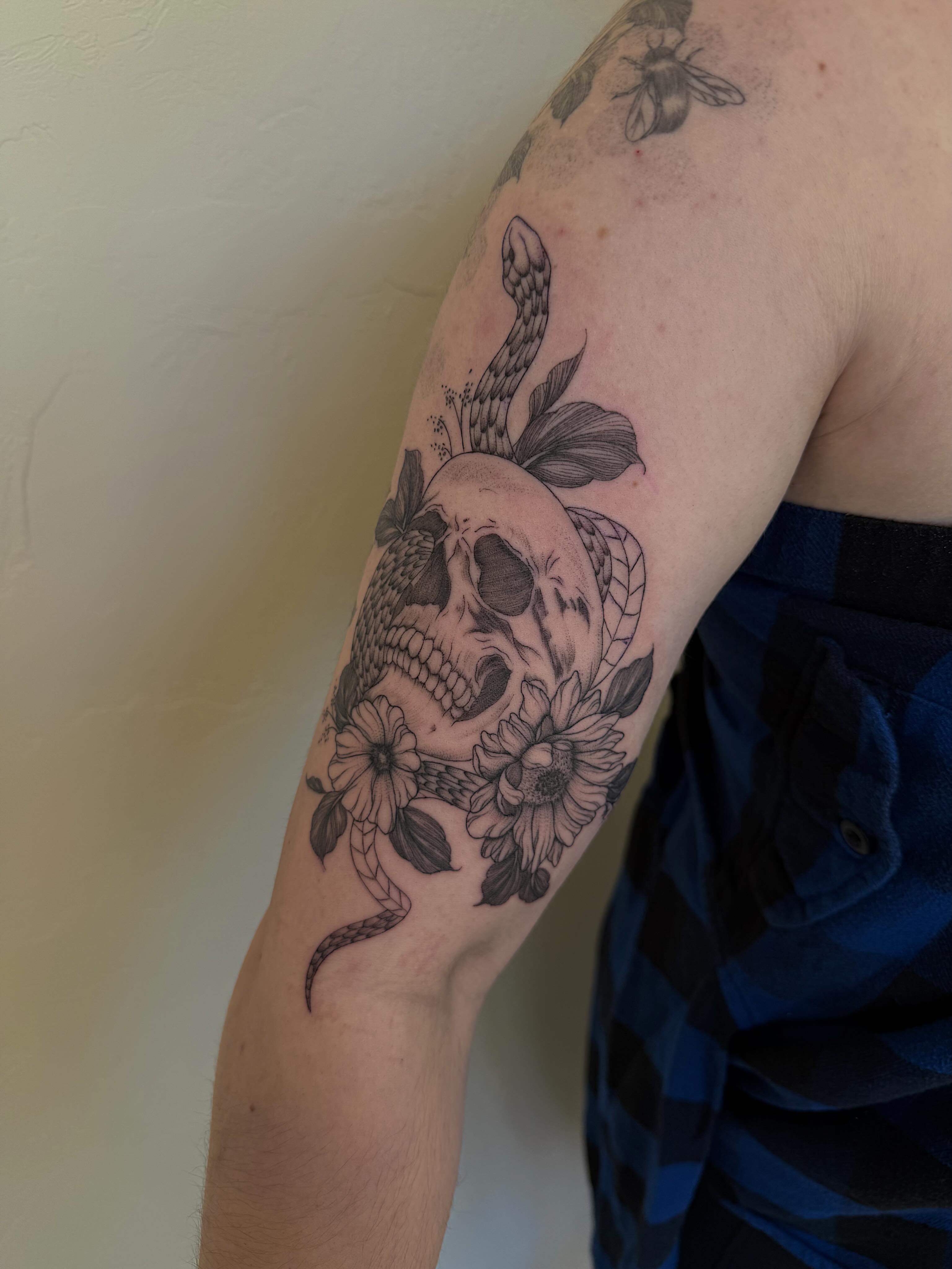Skull with flowers realism tattoo on the forearm by Shelby Lynn Bayles, Ogden, Utah