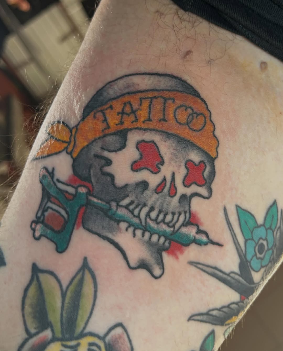 Skull with tattoo gun American traditional tattoo on the forearm by Casey Lewis - Tattoo Artist, Cleveland Ohio