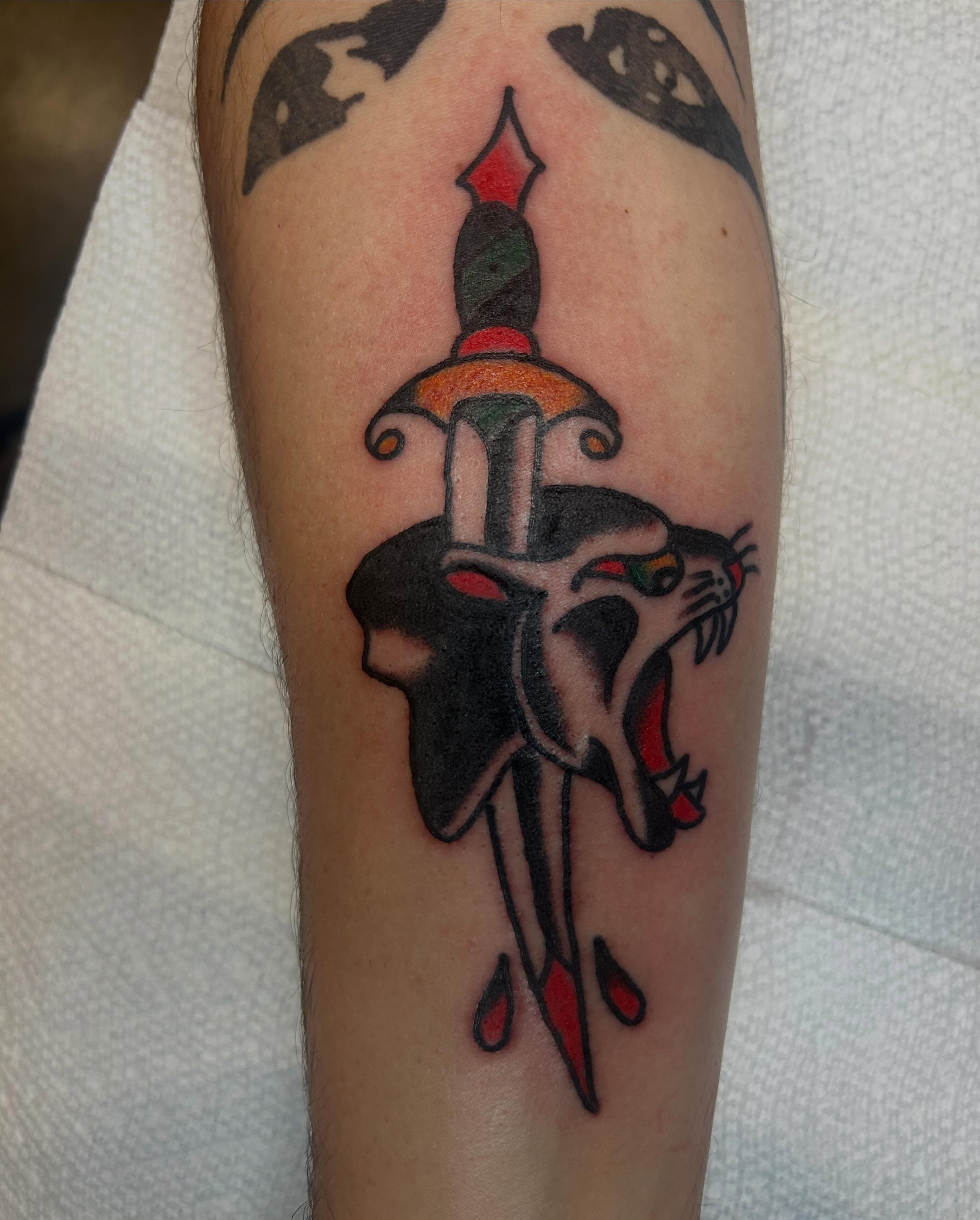 Sword and cat American traditional tattoo on the forearm by Casey Lewis - Tattoo Artist, Cleveland Ohio