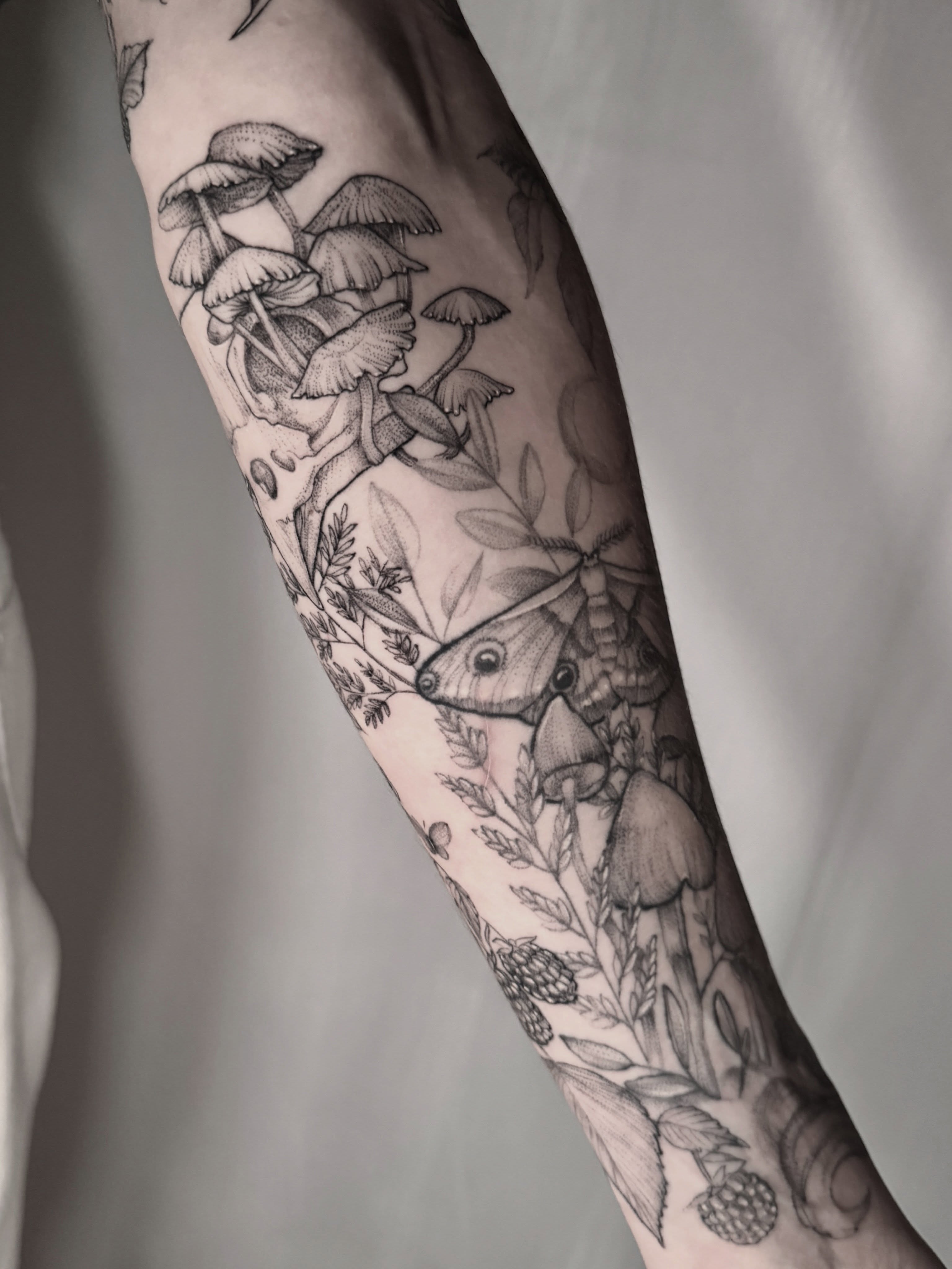 Mushrooms and moth dotwork tattoo on the forearm by Tattoos by Robyn Pallotta, Austin, Texas