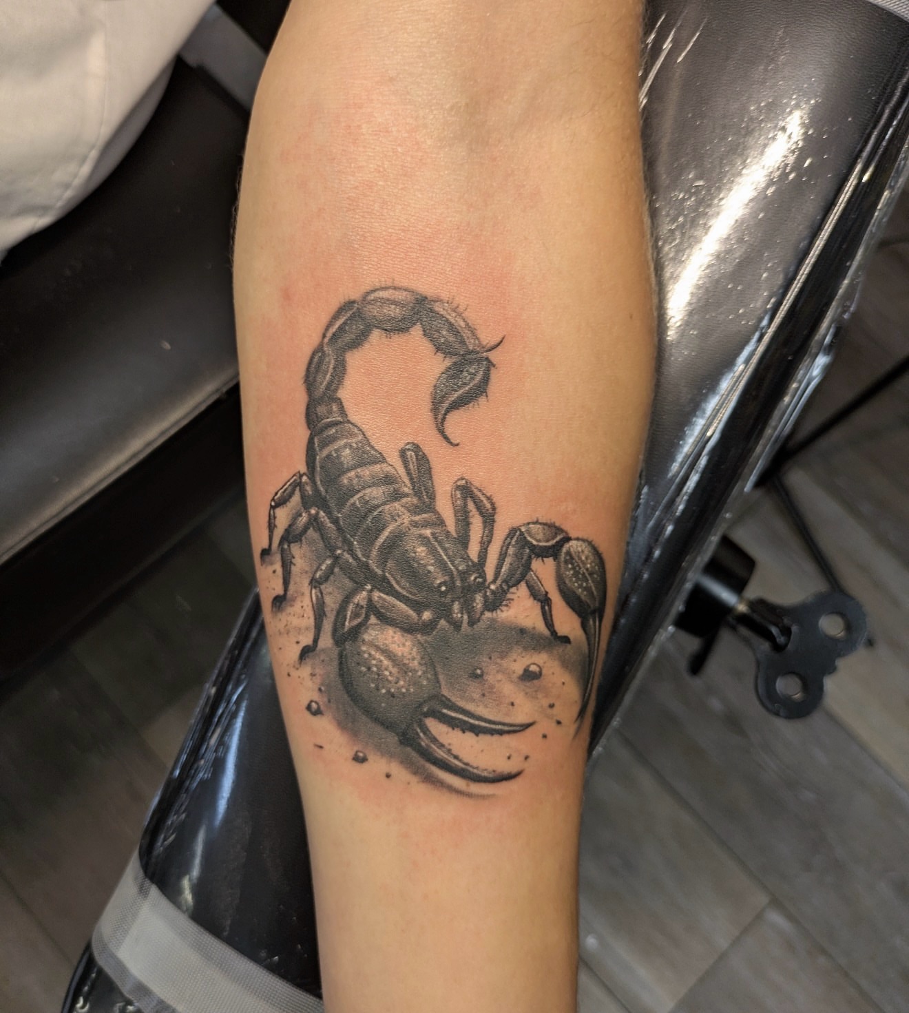 Scorpion black and grey tattoo on the forearm by Buddy K.