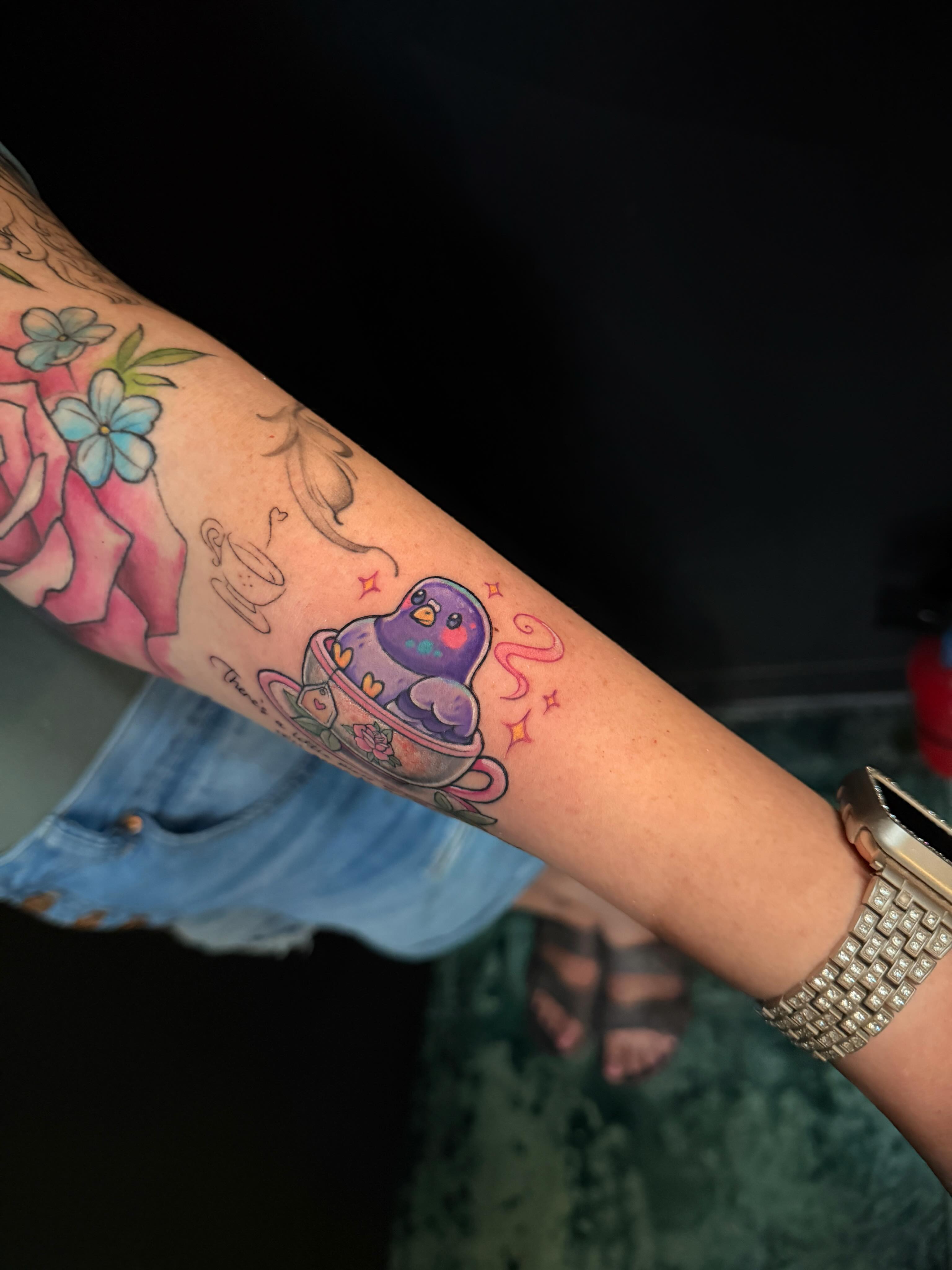 Bird in teacup new school tattoo on the forearm by Violet Michelle Williams, Charlotte, North Carolina