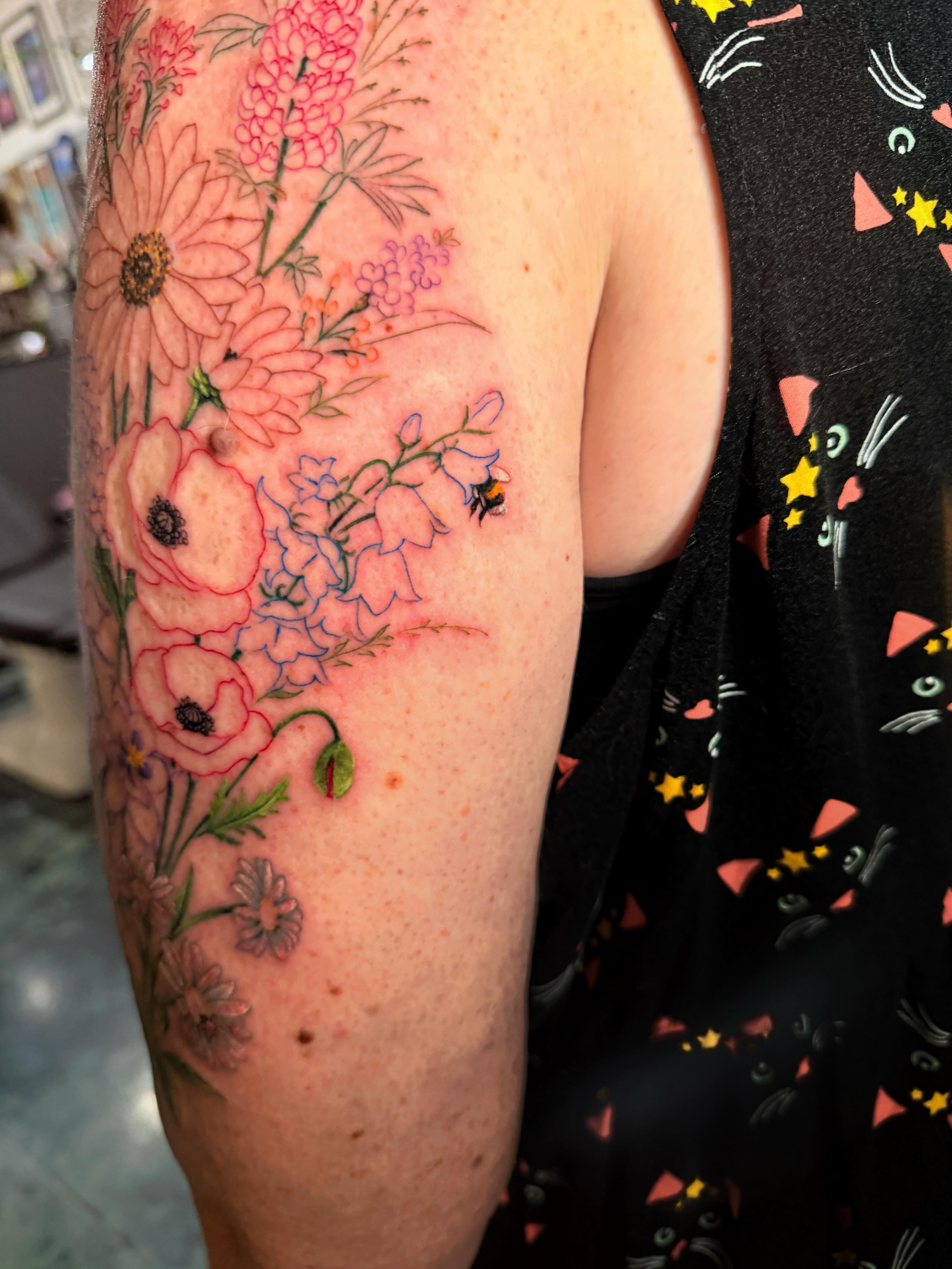 Floral bouquet realism tattoo on the forearm by Violet Michelle Williams, Charlotte, North Carolina