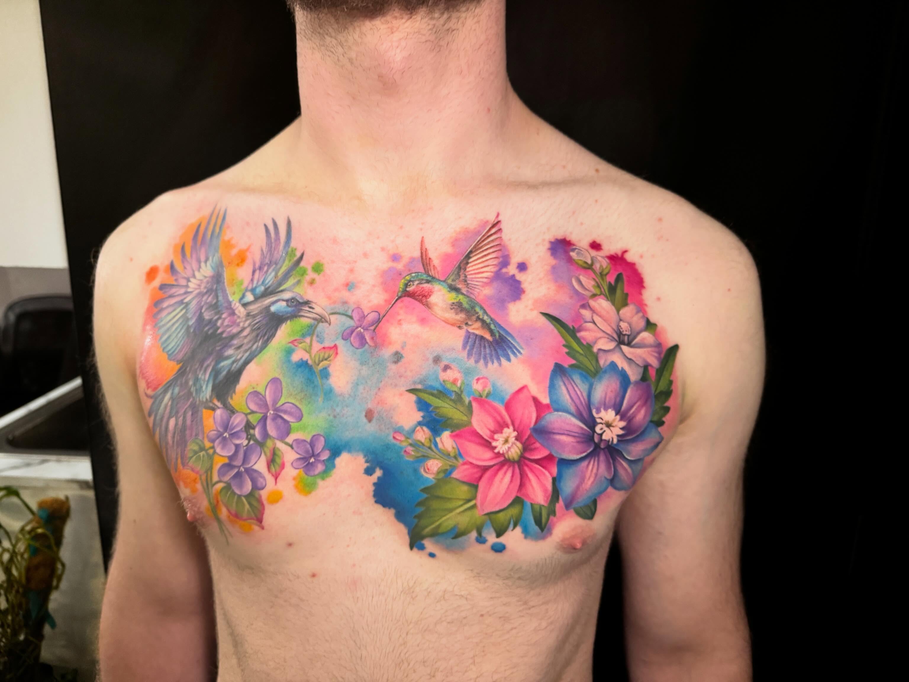 Birds and flowers watercolor tattoo on the chest by Violet Michelle Williams, Charlotte, North Carolina