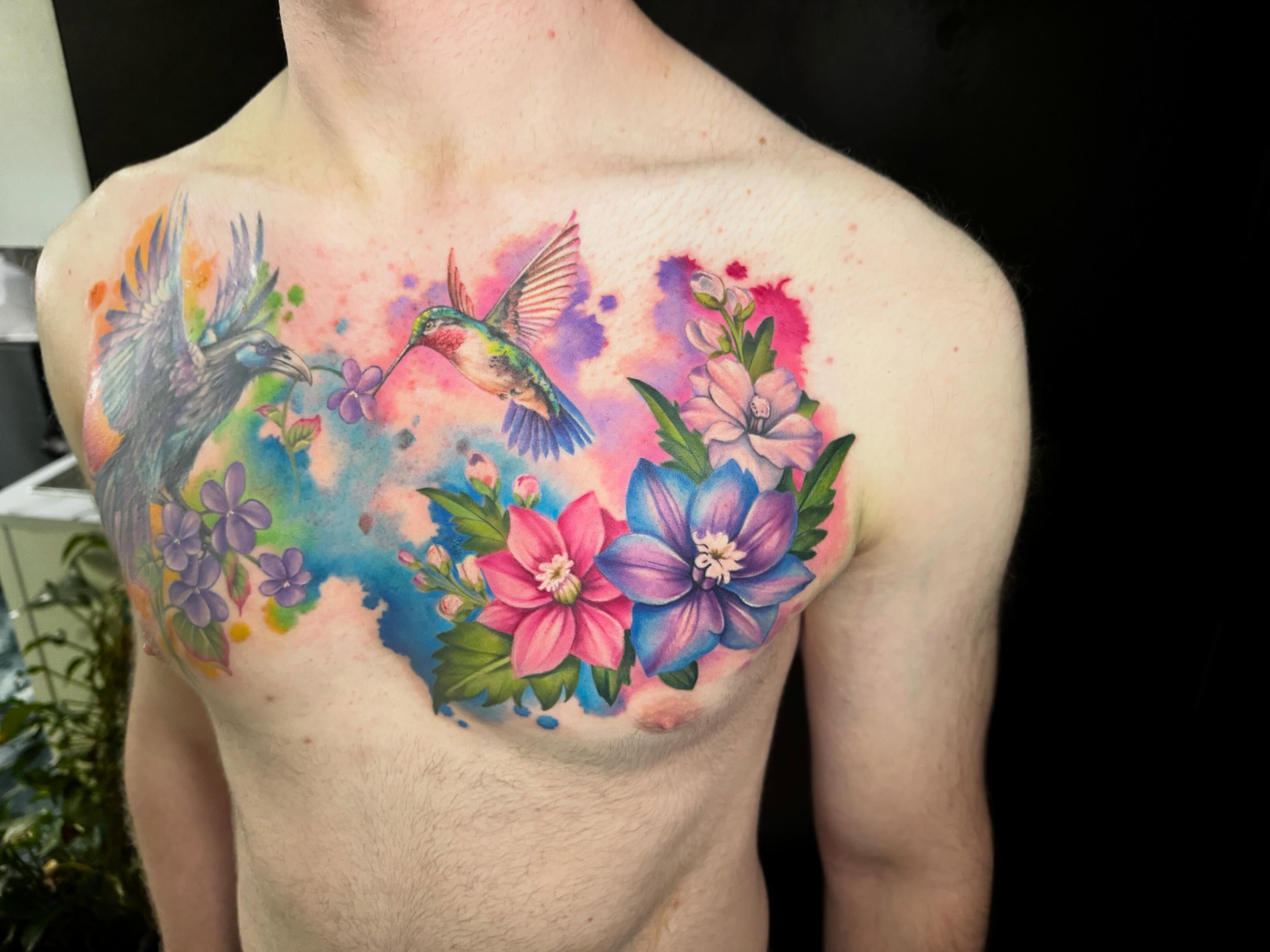 Hummingbirds and flowers watercolor tattoo on the chest by Violet Michelle Williams, Charlotte, North Carolina