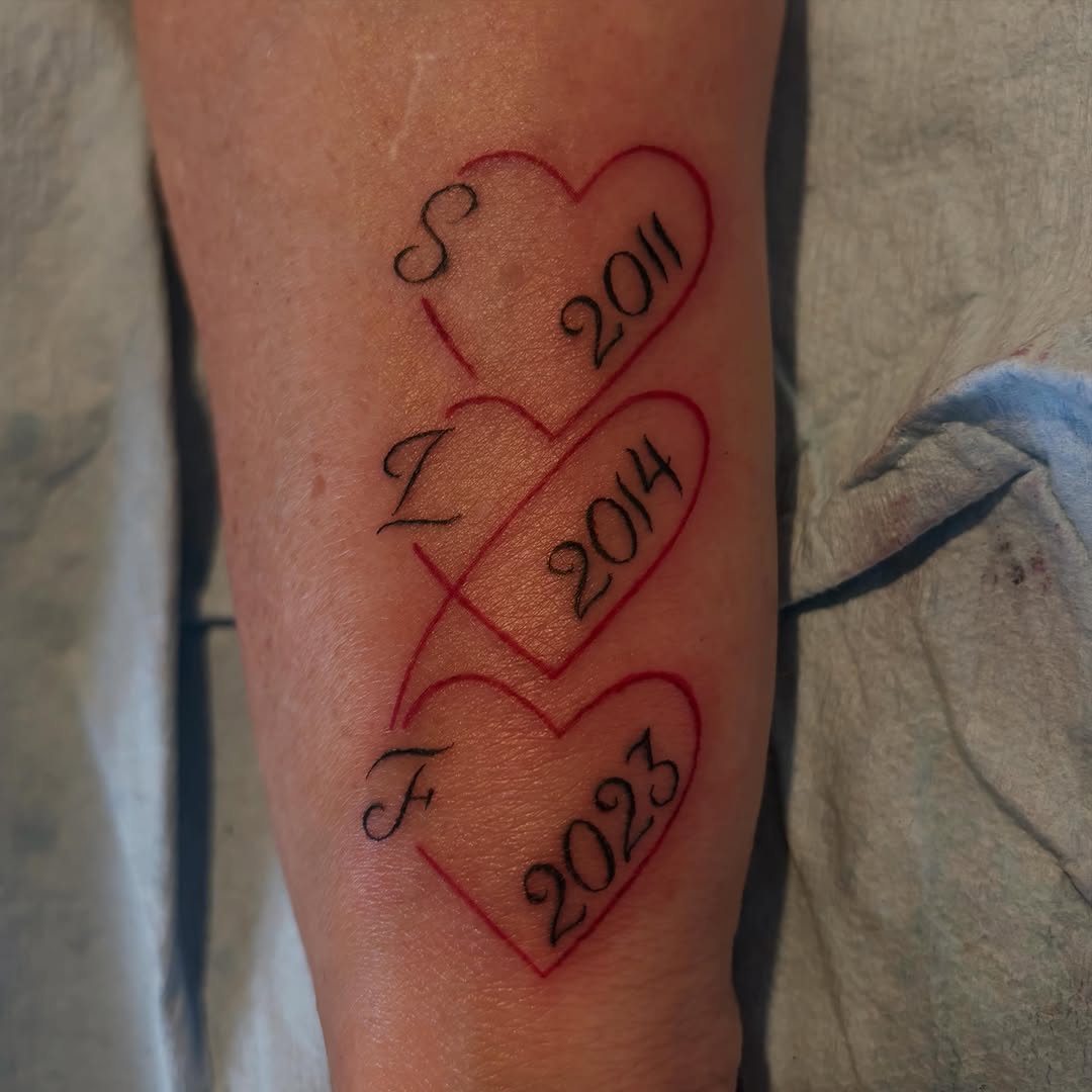 Three hearts with initials and dates minimalist tattoo on the forearm by πππ§ ππ’ππ π¨ πππππ¨π¨π¬