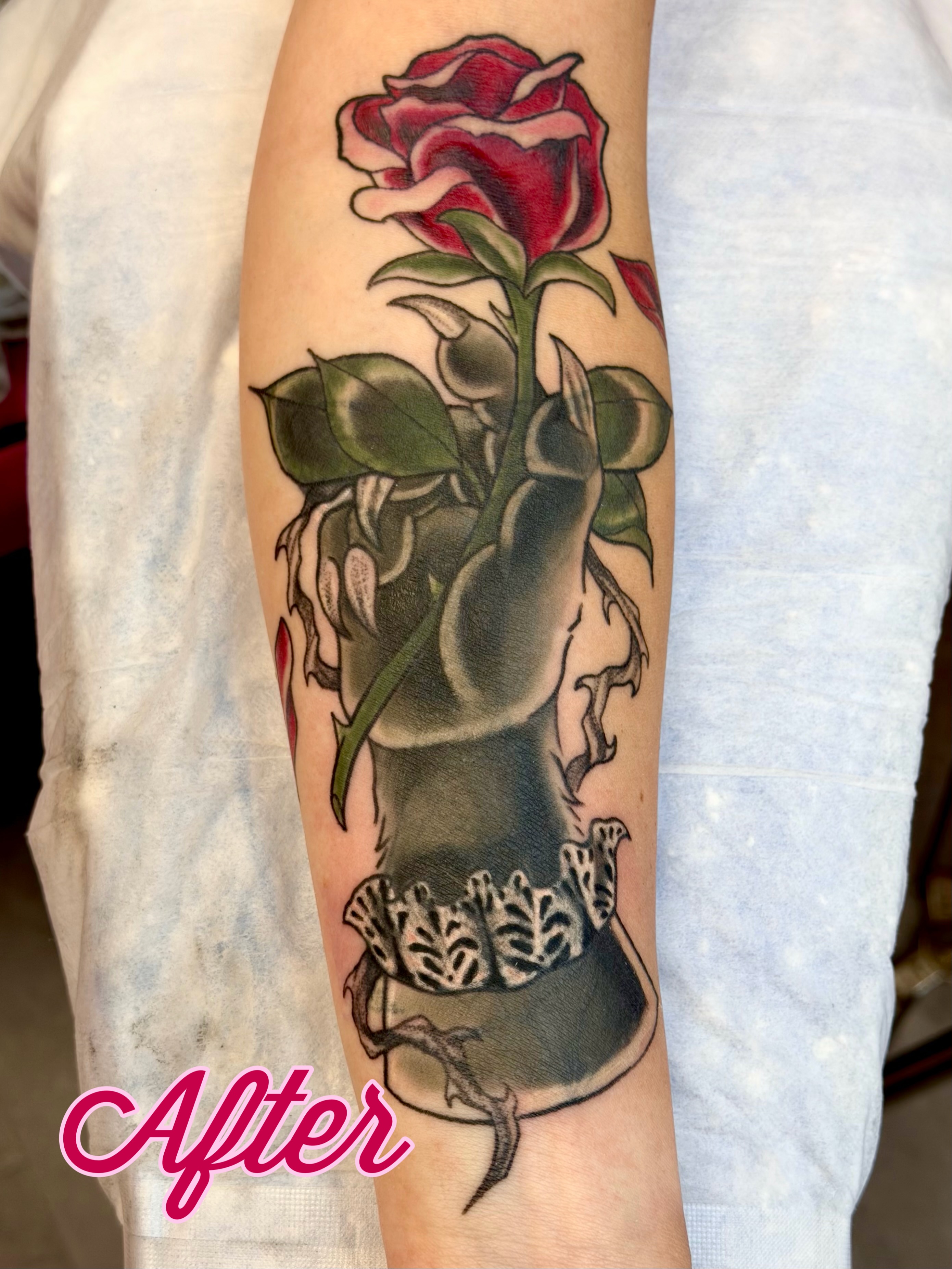 Rose and corset American traditional tattoo on the forearm by Caitlynn Austin