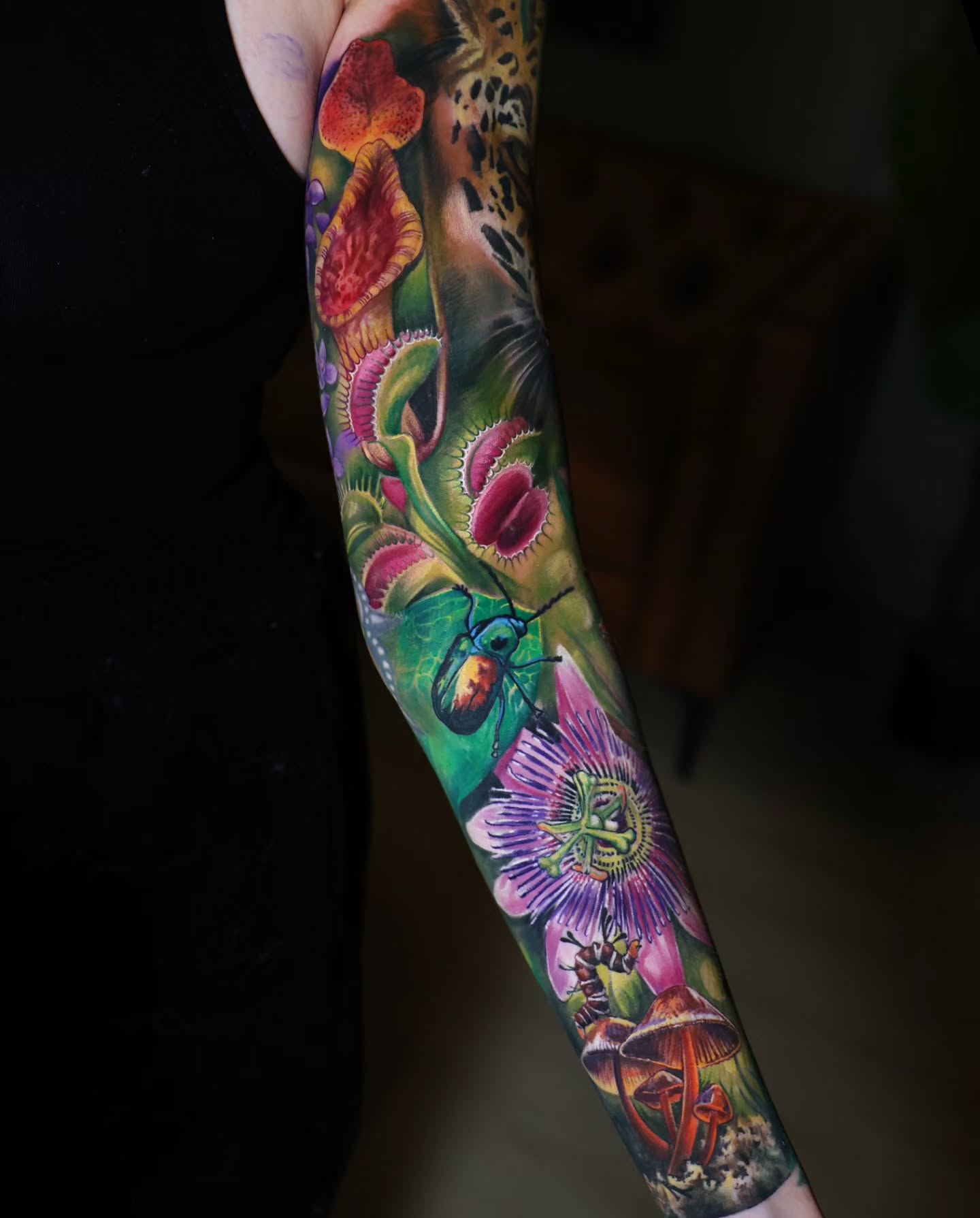 Botanical insects realism tattoo on the forearm by Marek Pawlik