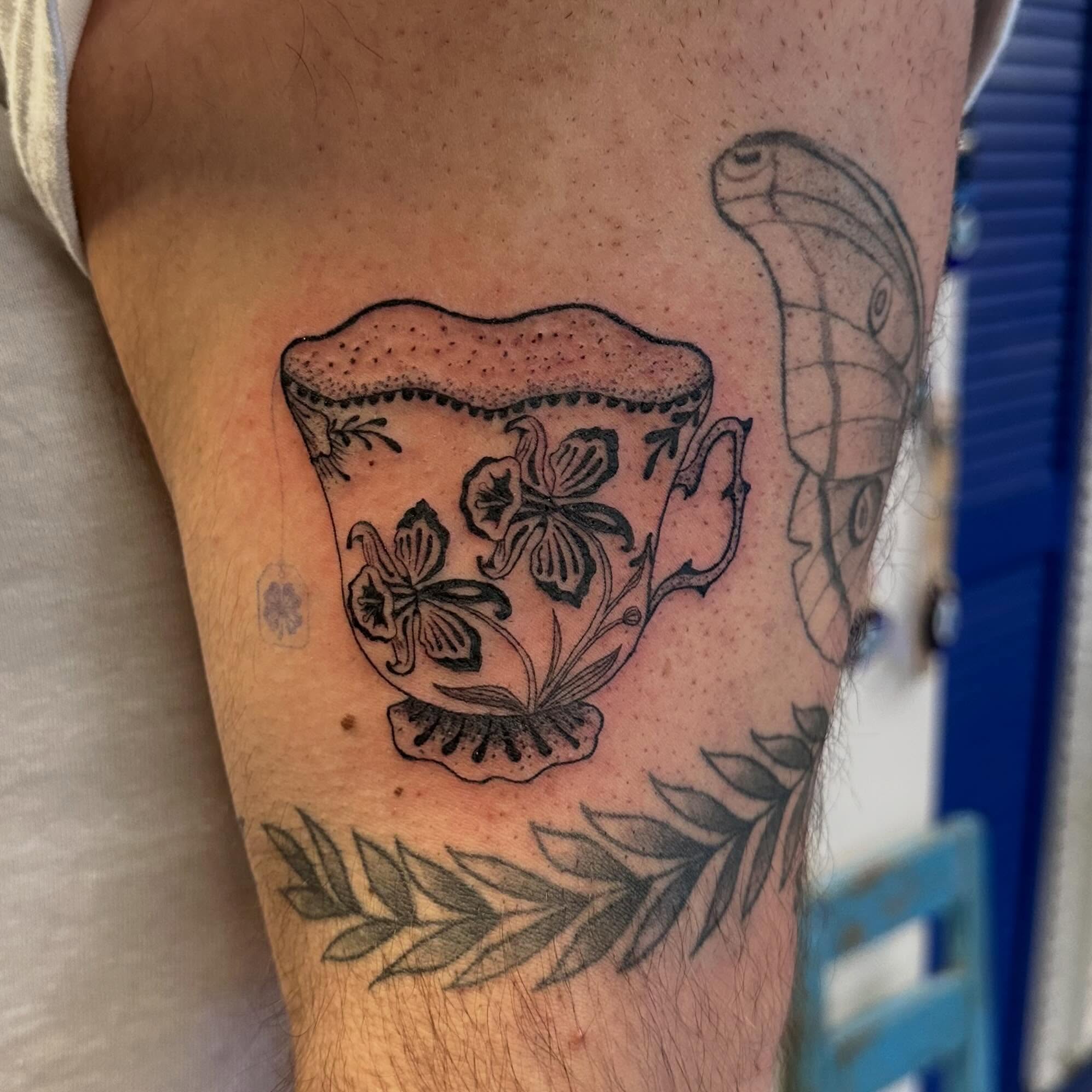 Teacup and orchids dotwork tattoo on the forearm by Lunette : a little moon as simple as that