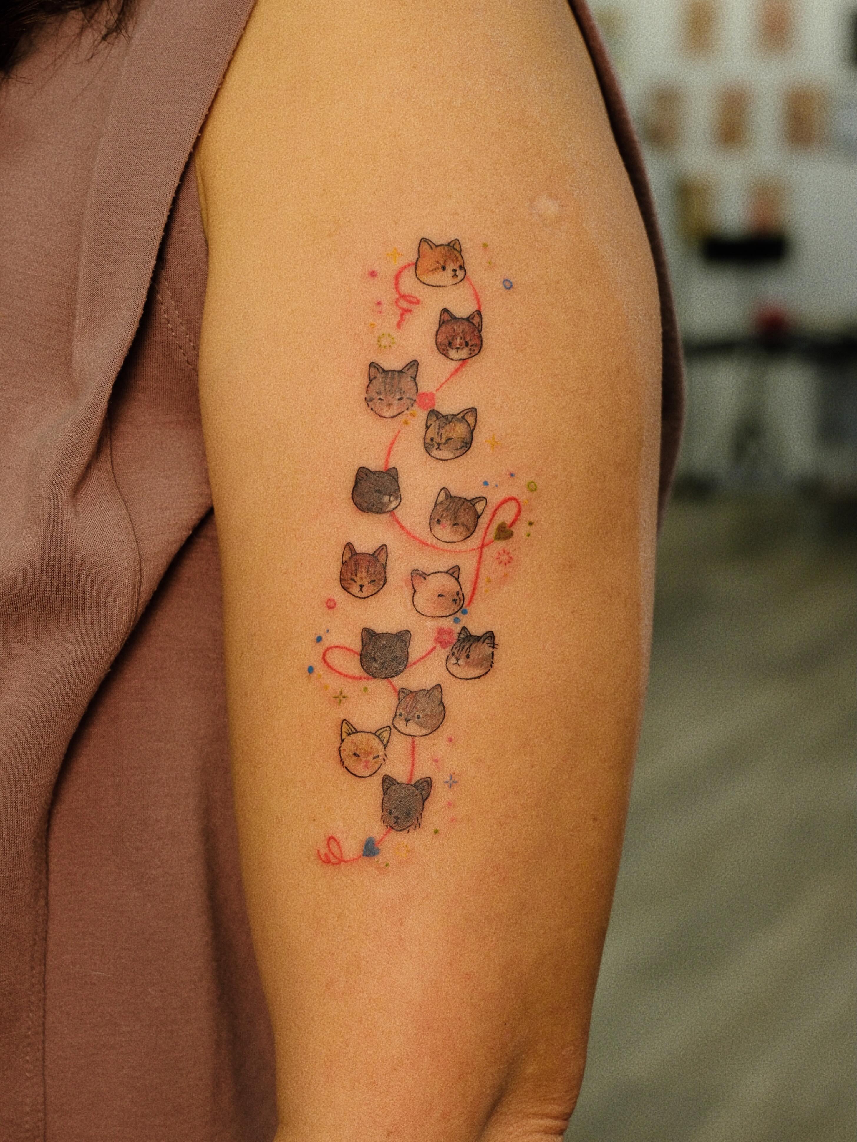 Cats dotwork tattoo on the forearm by rita_tattooist