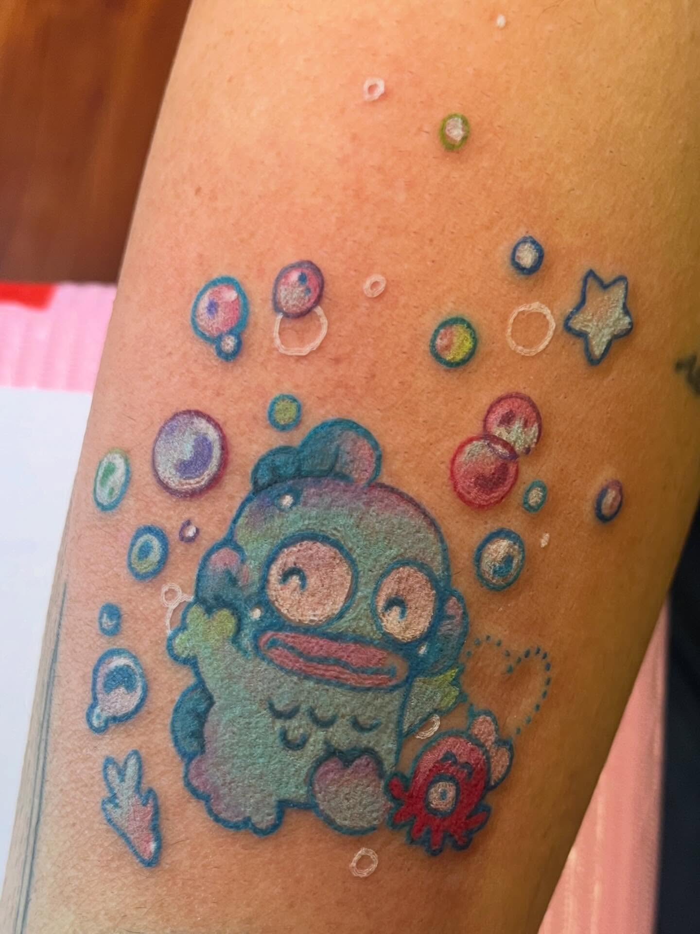 Octopus new school tattoo on the forearm by Cami Rose