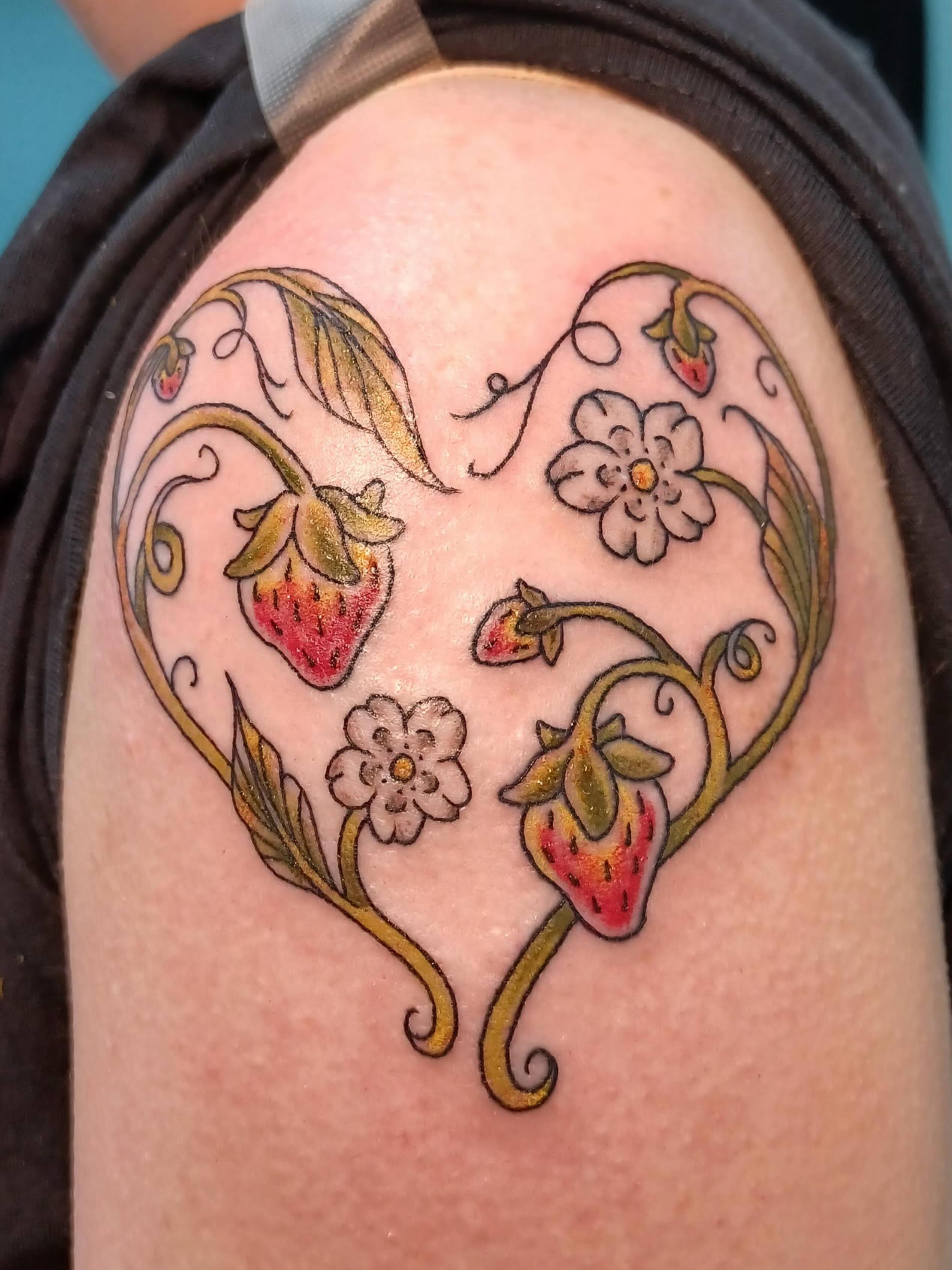 Strawberries and flowers new school tattoo on the shoulder by Abi