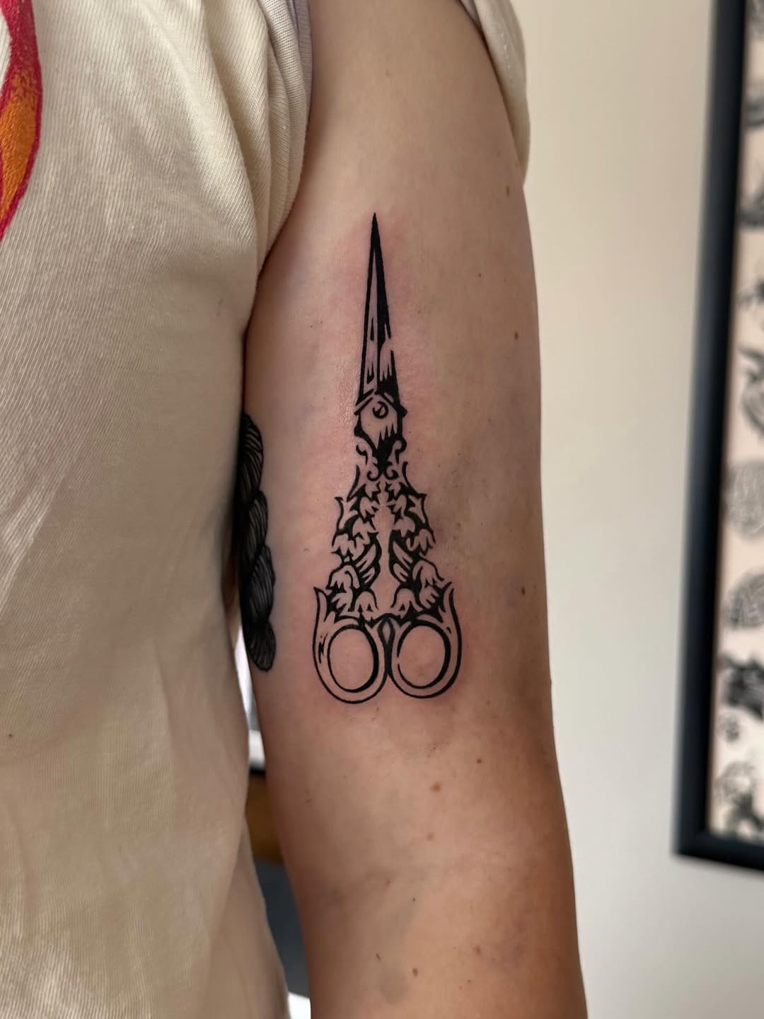 Ornate scissors dotwork tattoo on the forearm by M