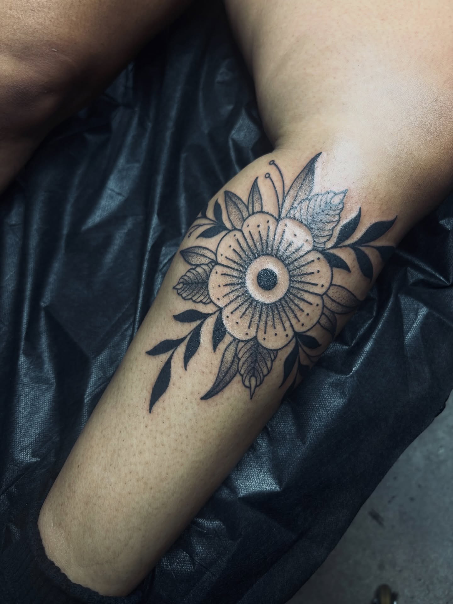 Flower dotwork tattoo on the forearm by Kolbi Alexis