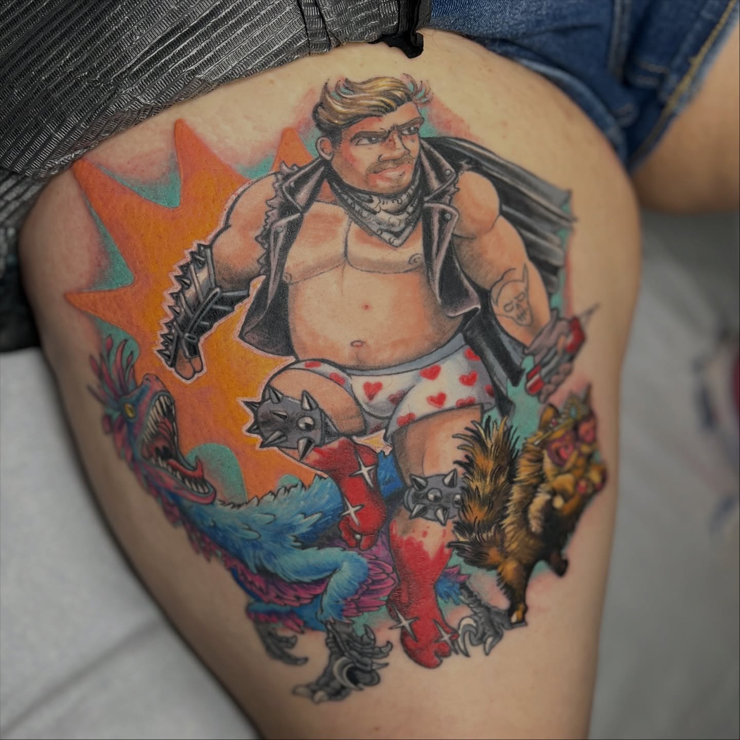 Man with monsters illustrative tattoo on the thigh by Alex Santaloci