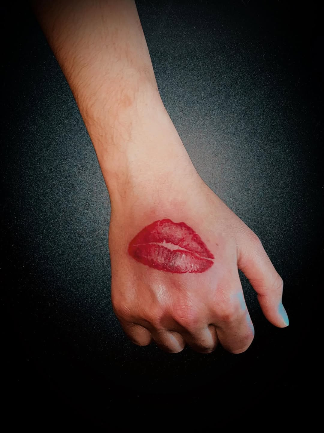 Lips tattoo on the hand by Alejandro N Duran