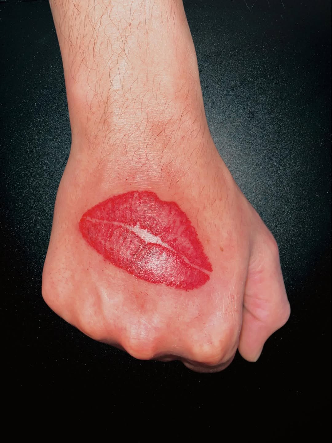 Lips tattoo on the hand by Alejandro N Duran