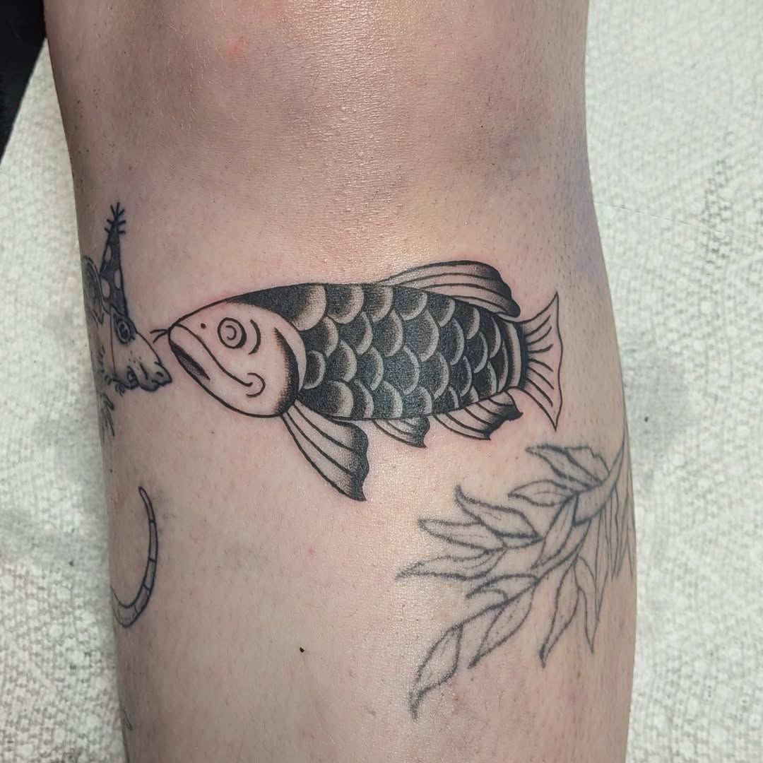 Fish fine line tattoo on the forearm by Kam