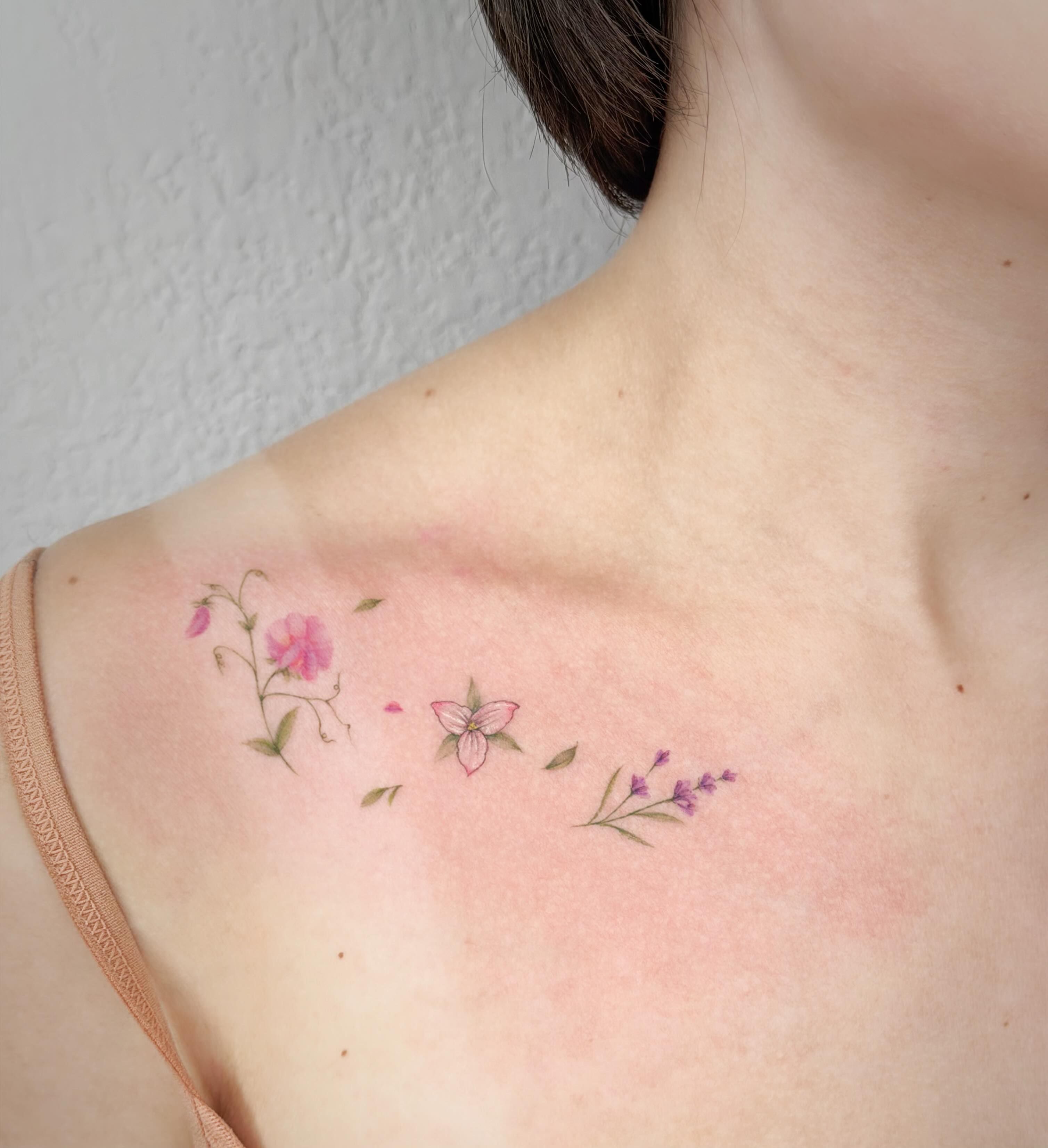 Floral arrangement watercolor tattoo on the shoulder by Seattle tattoo artist-Mia