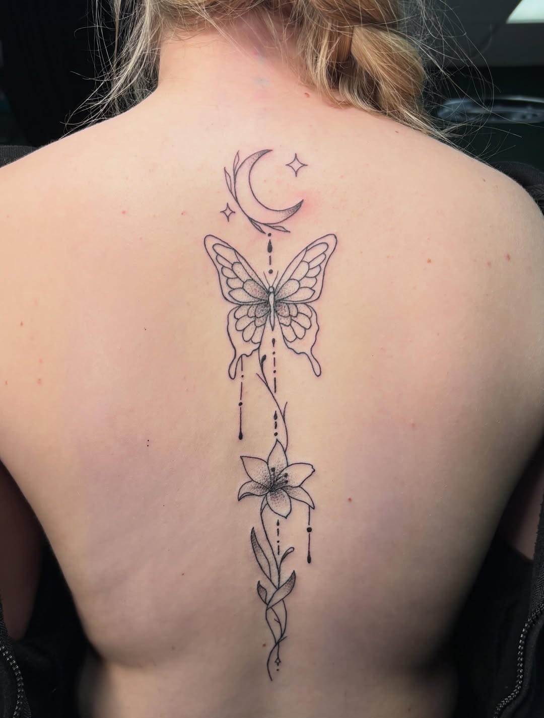 Butterfly, moon, and lily fine line tattoo on the back by ππ‘ππ―π² πππ₯π₯ππ²