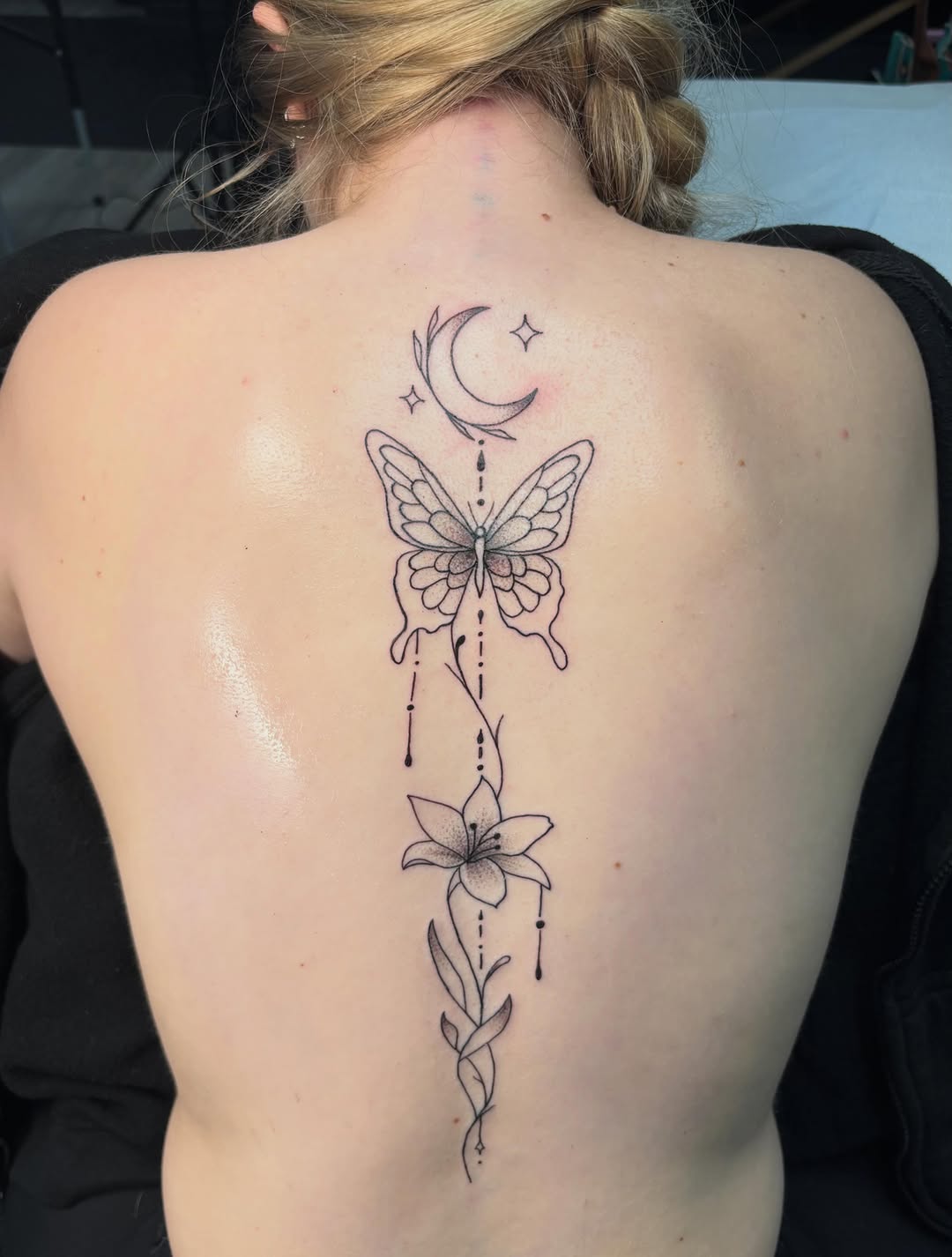 Butterfly, lily, moon and stars fine line tattoo on the back by ππ‘ππ―π² πππ₯π₯ππ²