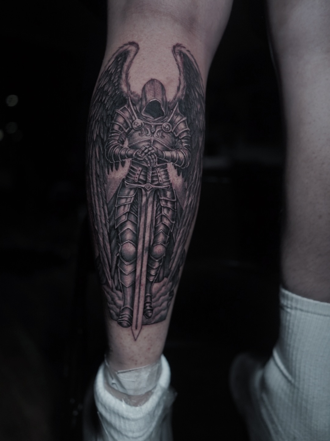 Winged knight realism tattoo on the forearm by Niko Hosk Cataldo