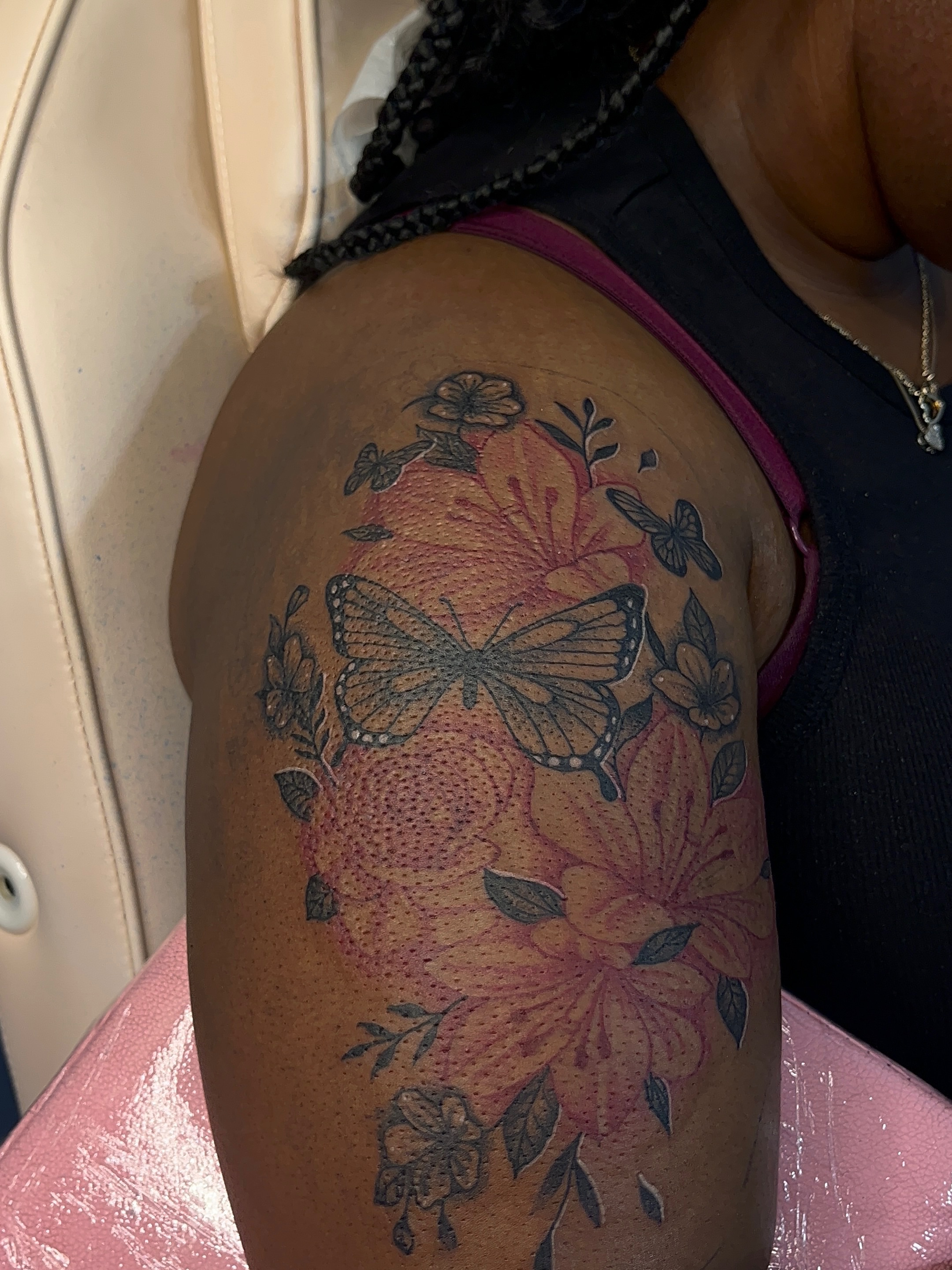 Butterfly and flowers dotwork tattoo on the shoulder by The inspo