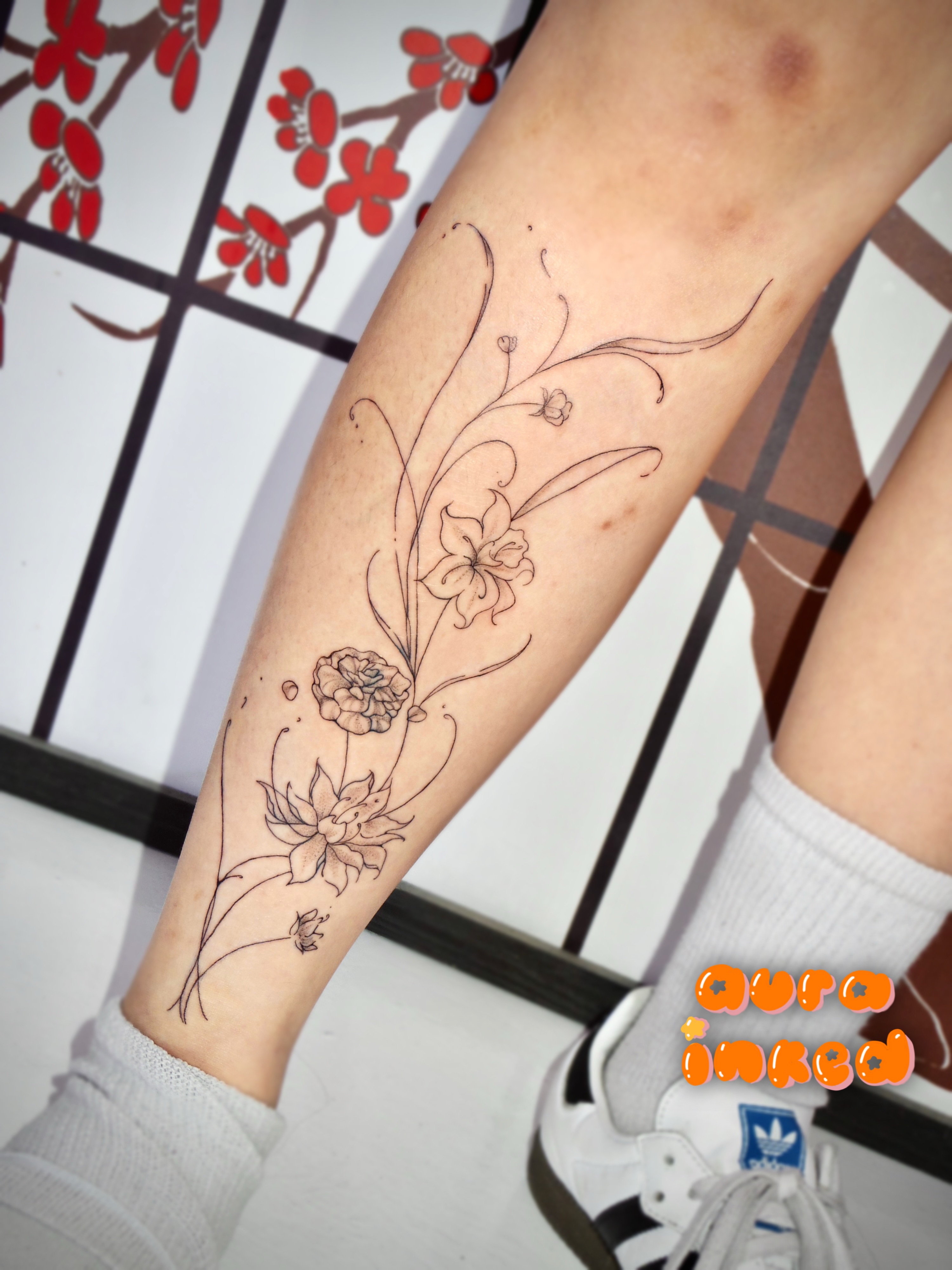 Floral design fine line tattoo on the forearm by Delly ⌯