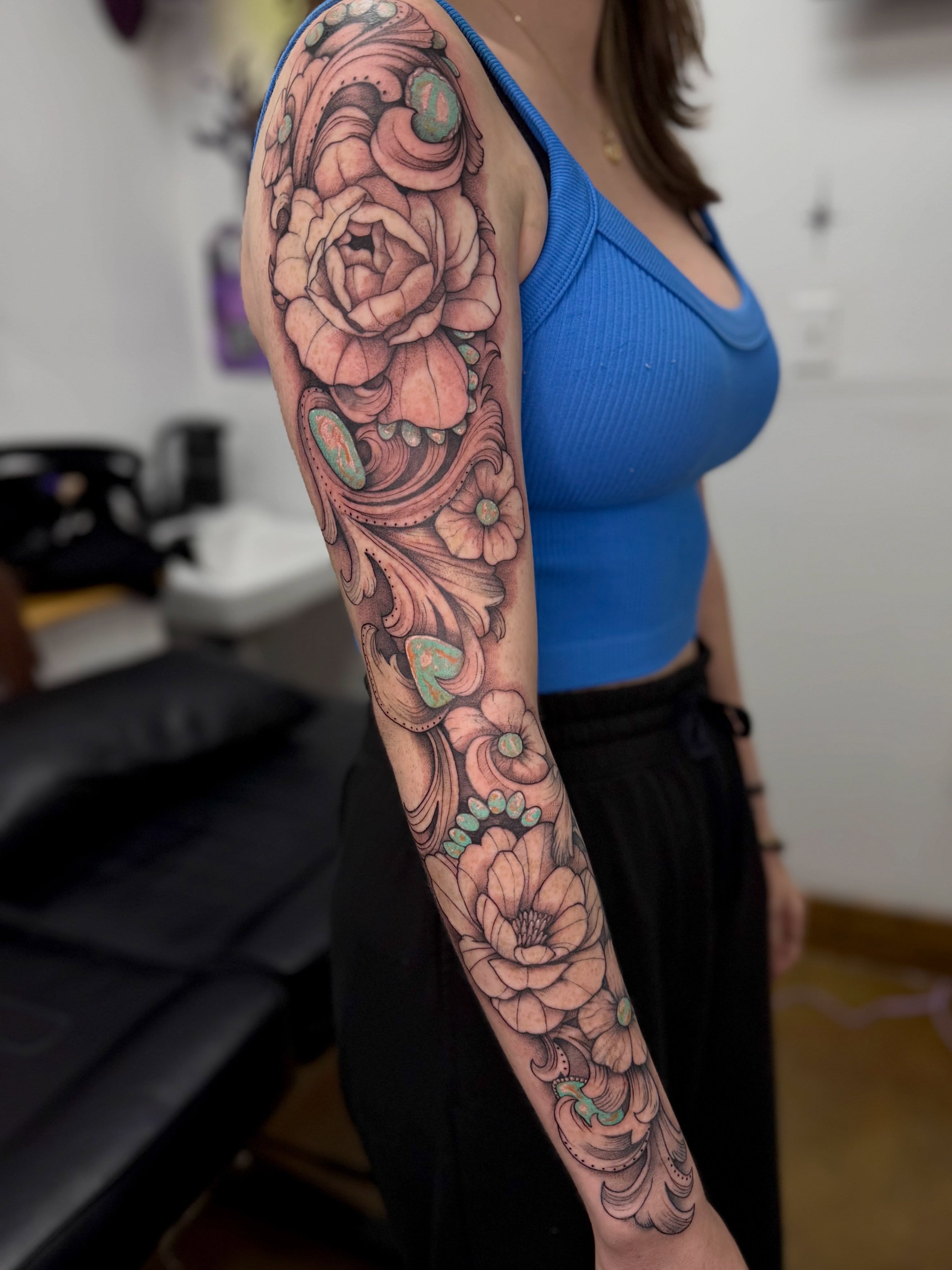 Floral bouquet neo-traditional tattoo on the forearm by Halle Cooper
