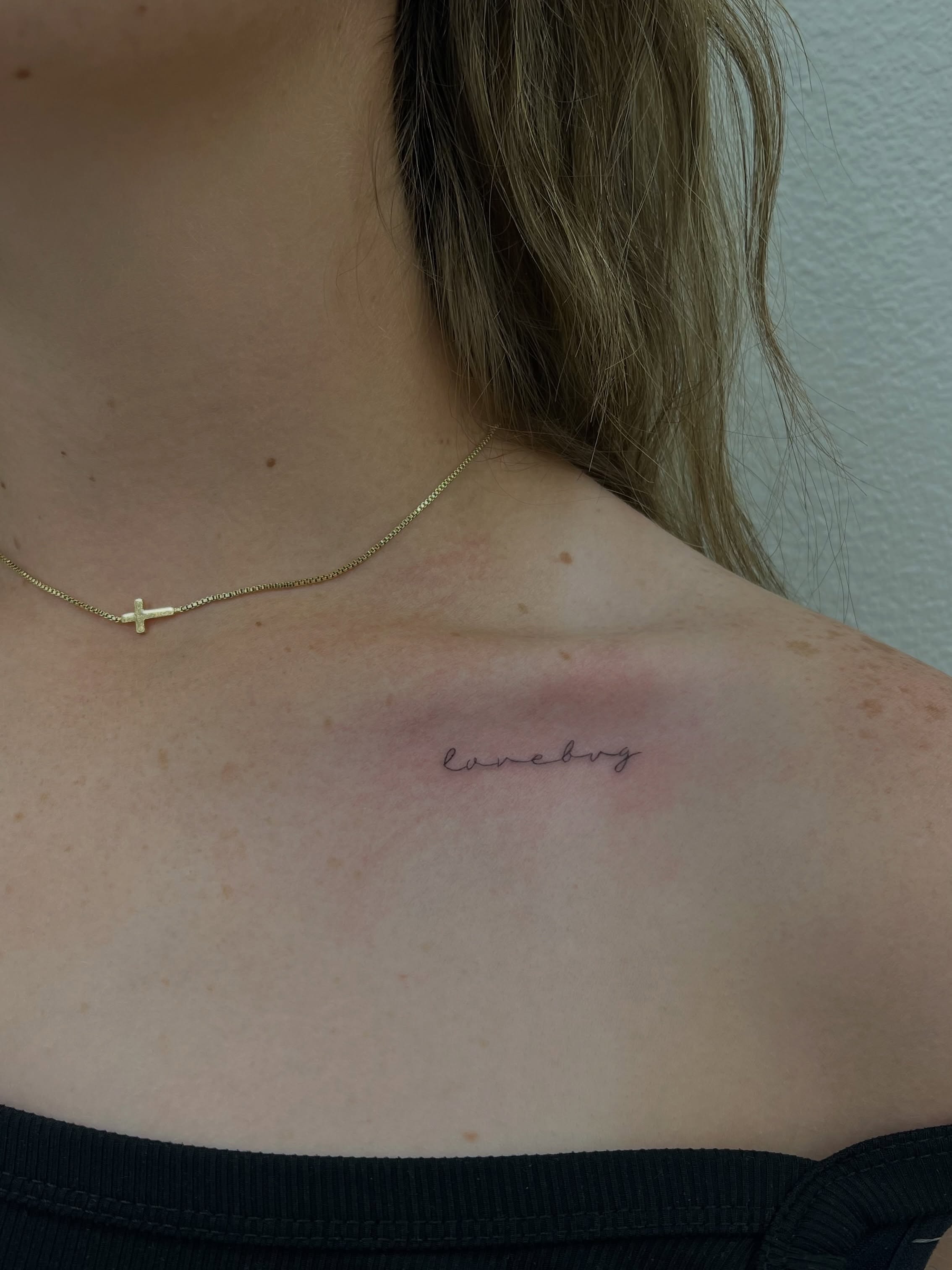 Lovebug lettering script tattoo on the shoulder by Vanessa ♡ UTAH FINE LINE TATTOO + LIP BLUSH