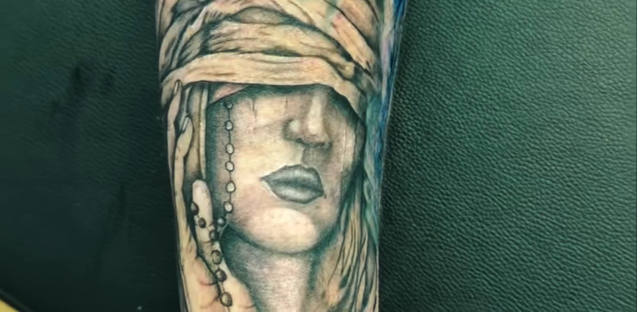 Blindfolded woman portrait realism tattoo on the forearm by Tattoos by Dan Hatcher Carr, Parma, Ohio