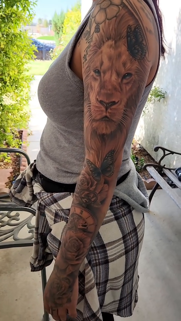 Lion and roses sleeve sketch tattoo on the upper arm by @youxg_guxxz