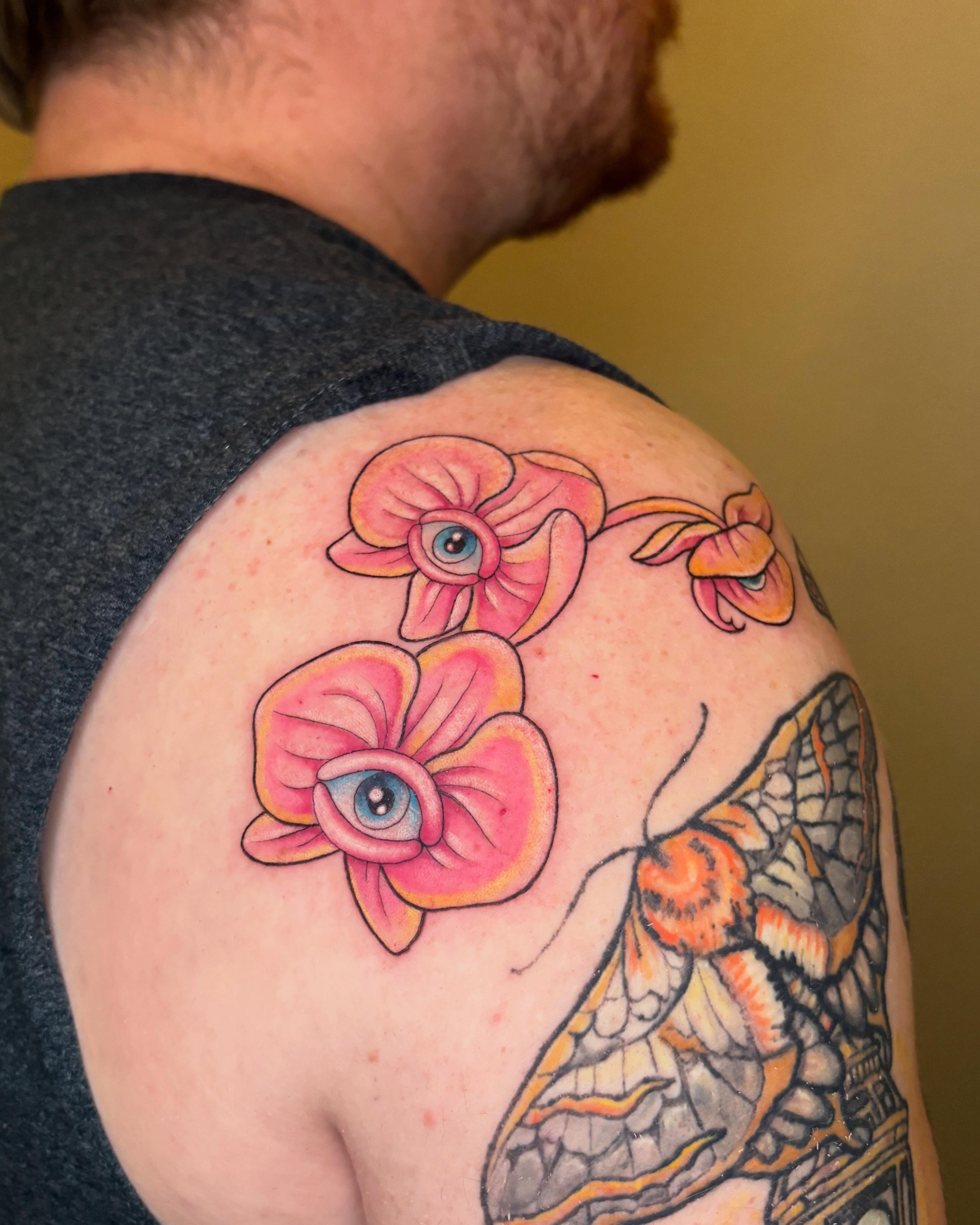Eye and flowers new school tattoo on the shoulder by Autumn