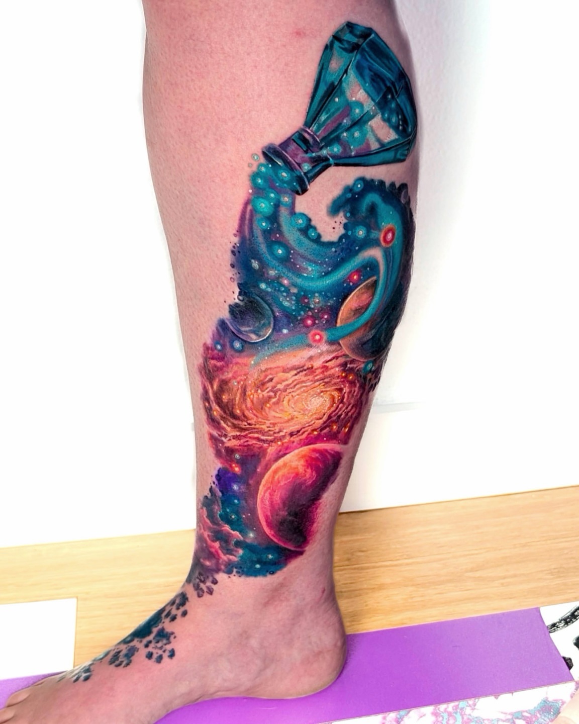 Galaxy dotwork tattoo on the calf by Amy Zager
