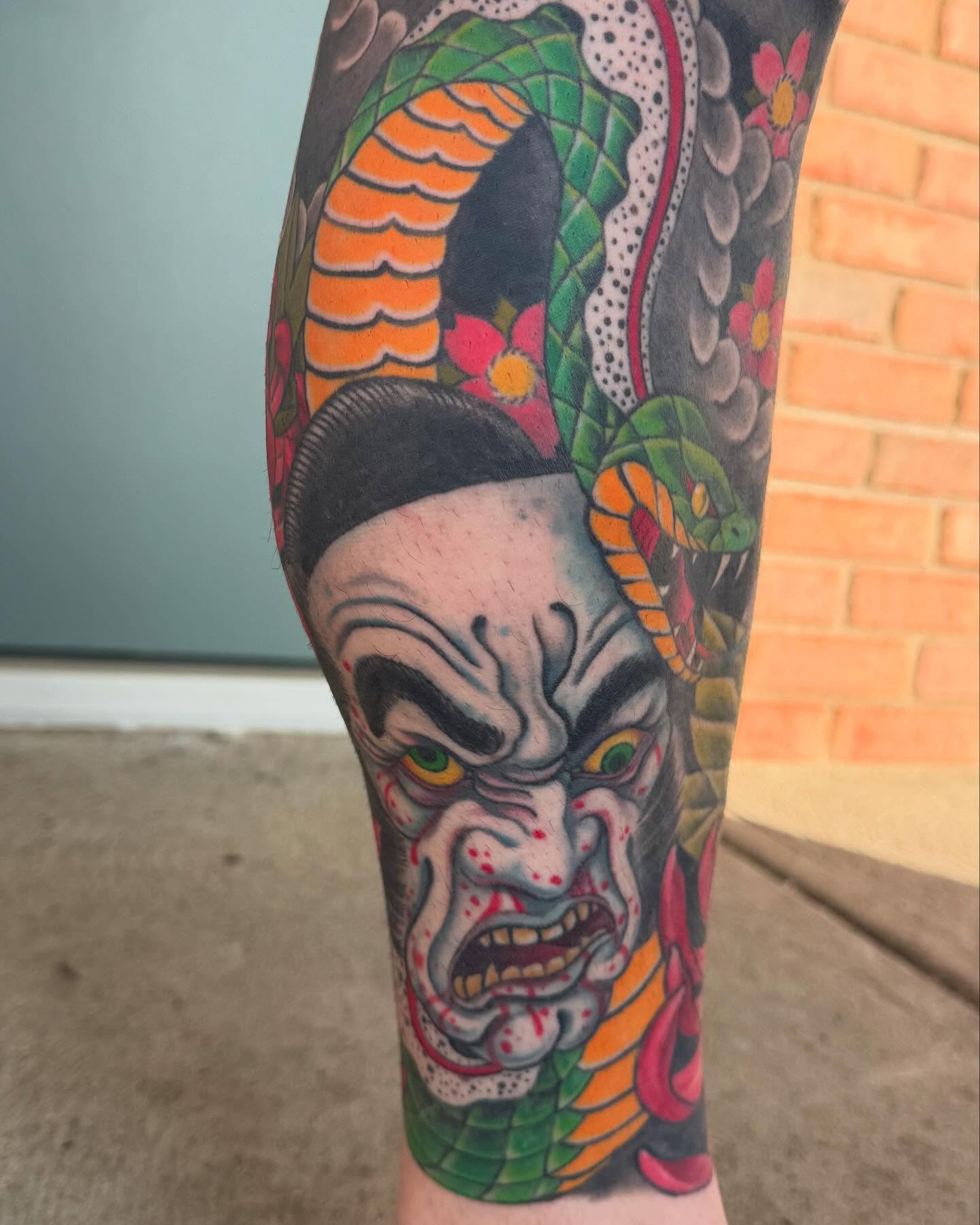 Demon mask japanese irezumi tattoo on the forearm by Jesse Gray
