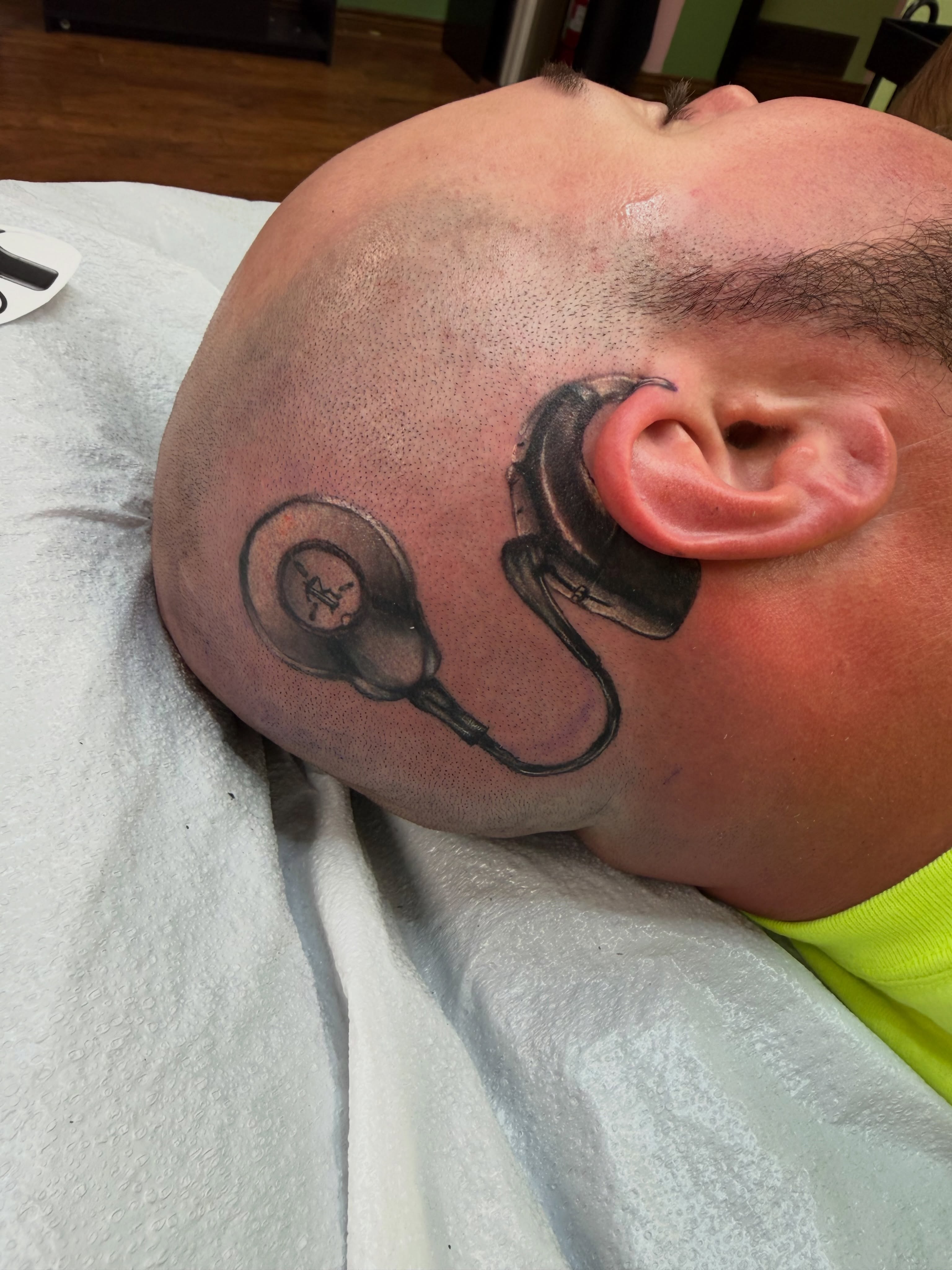 Headphones realism tattoo on the head by Luna Faye
