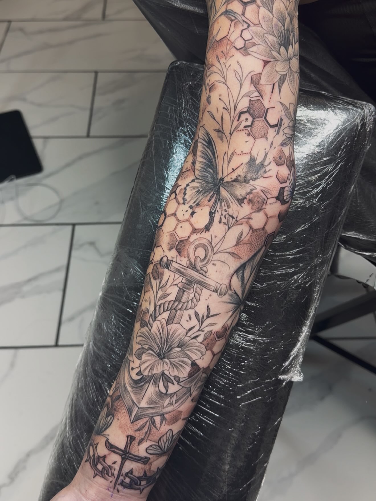 Floral and butterfly realism tattoo on the forearm by Adrian gonzalez...