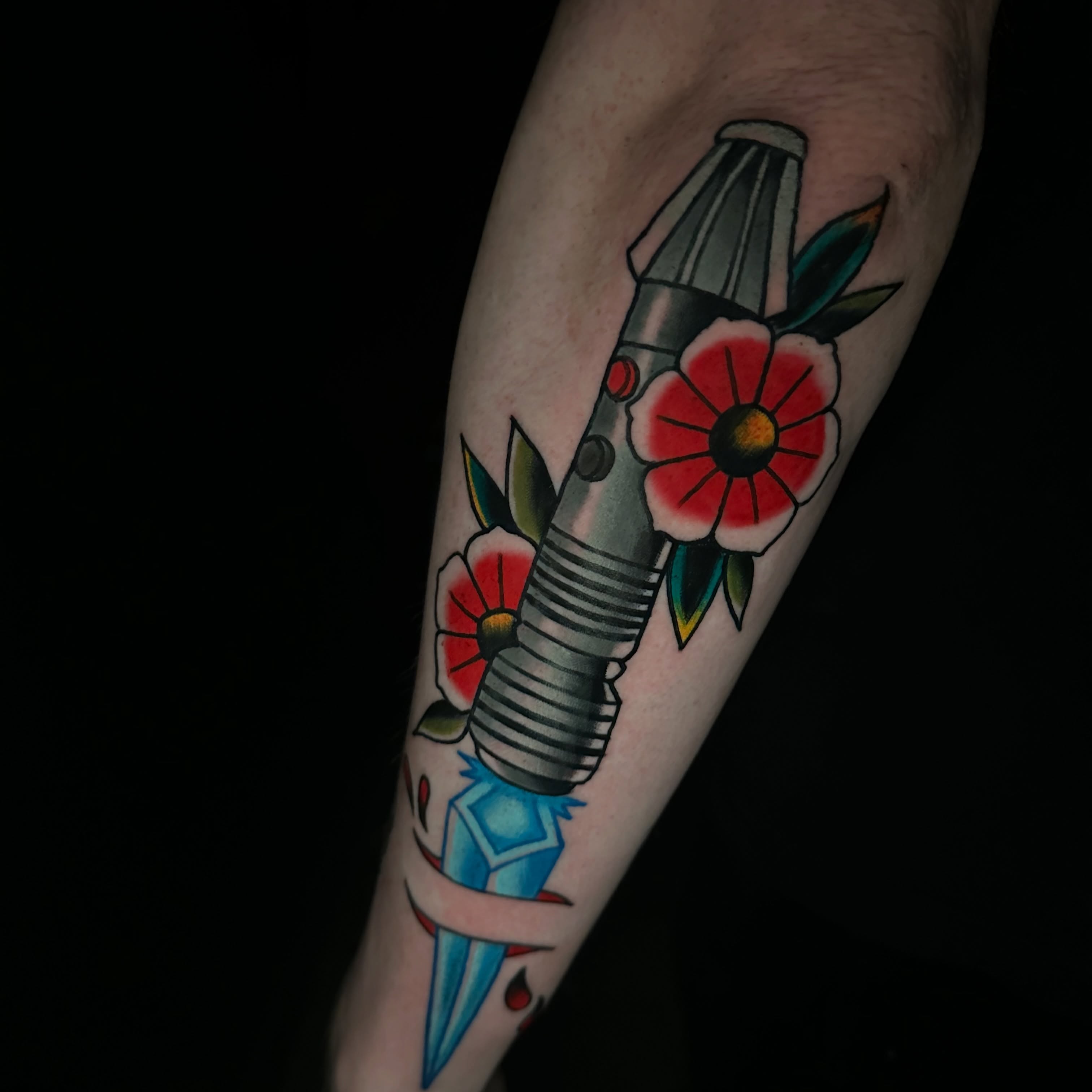 Rocket and flowers American traditional tattoo on the forearm by Andy Sharik