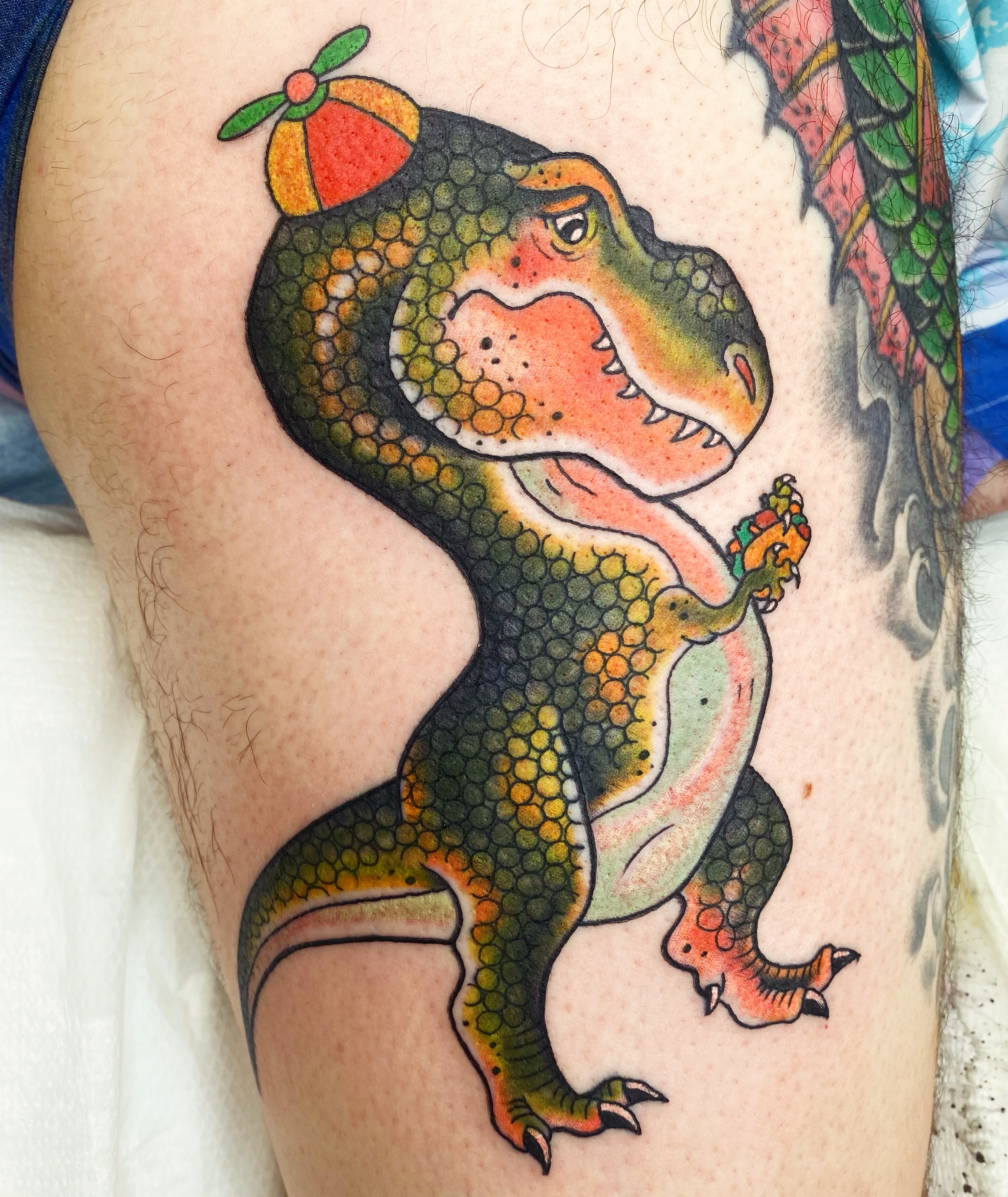 Dinosaur dotwork tattoo on the thigh by Aidan Monahan Tattoo