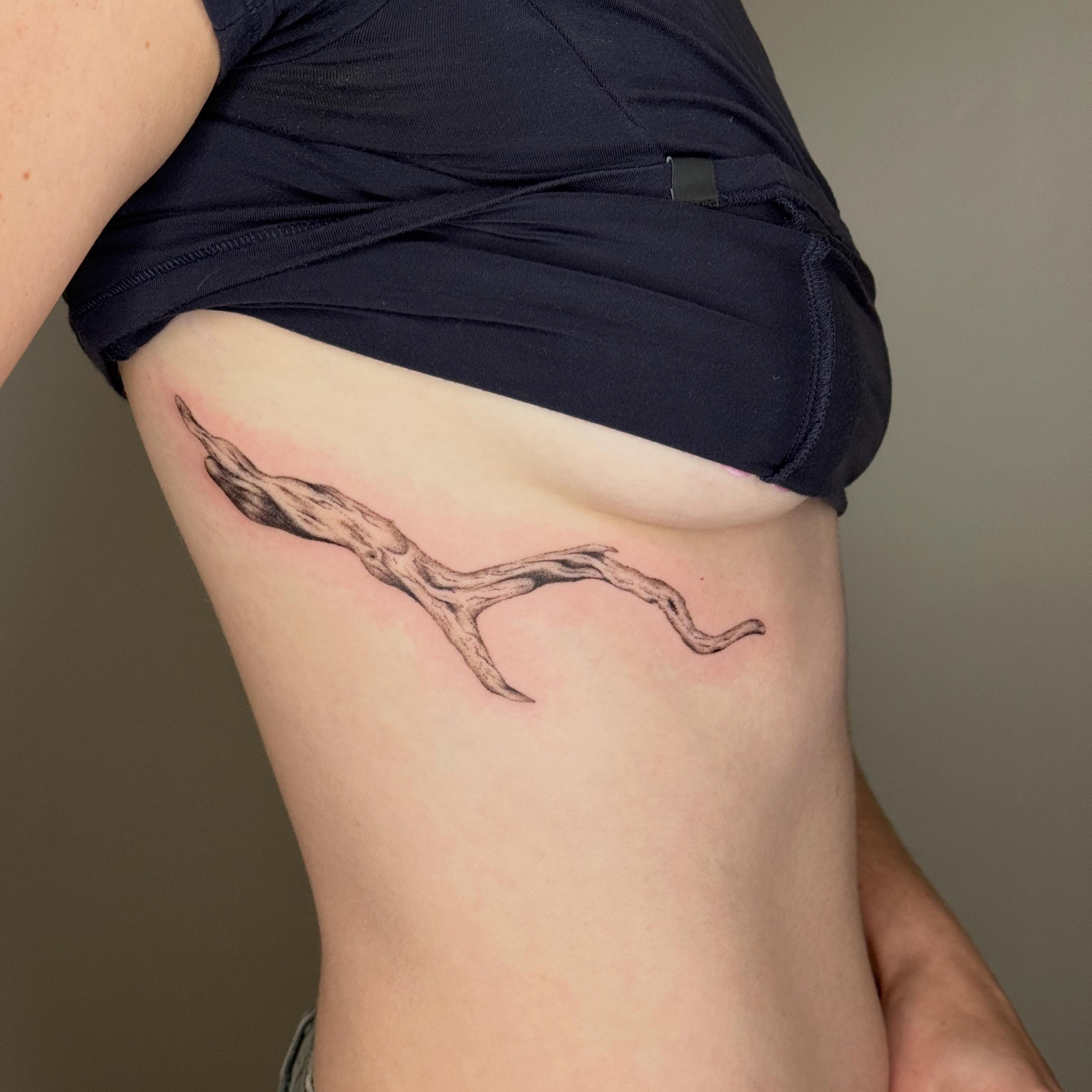 Antlers black and grey tattoo on the thigh by Monica Reynolds