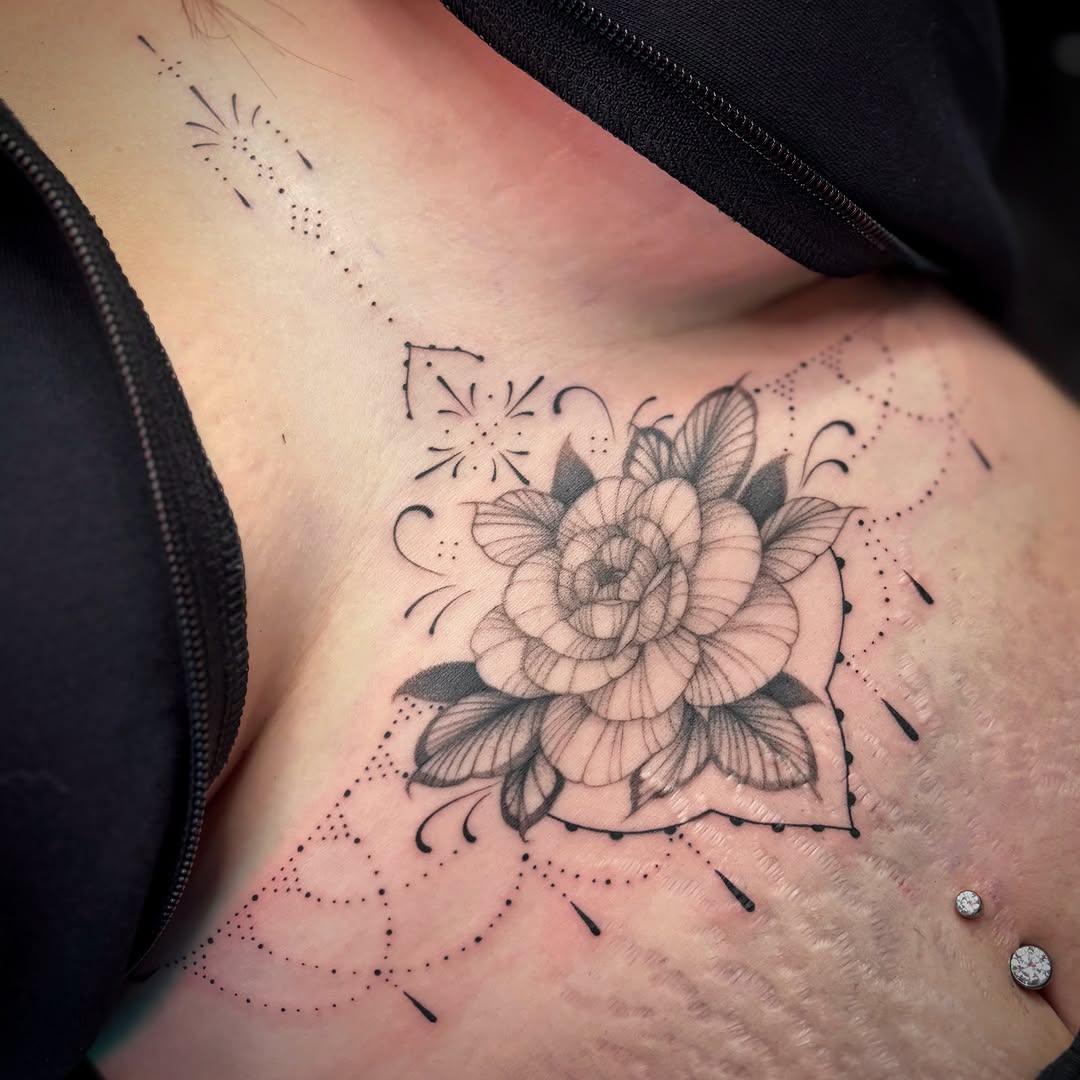 Flower dotwork tattoo on the ribs by Victoria Lamorte