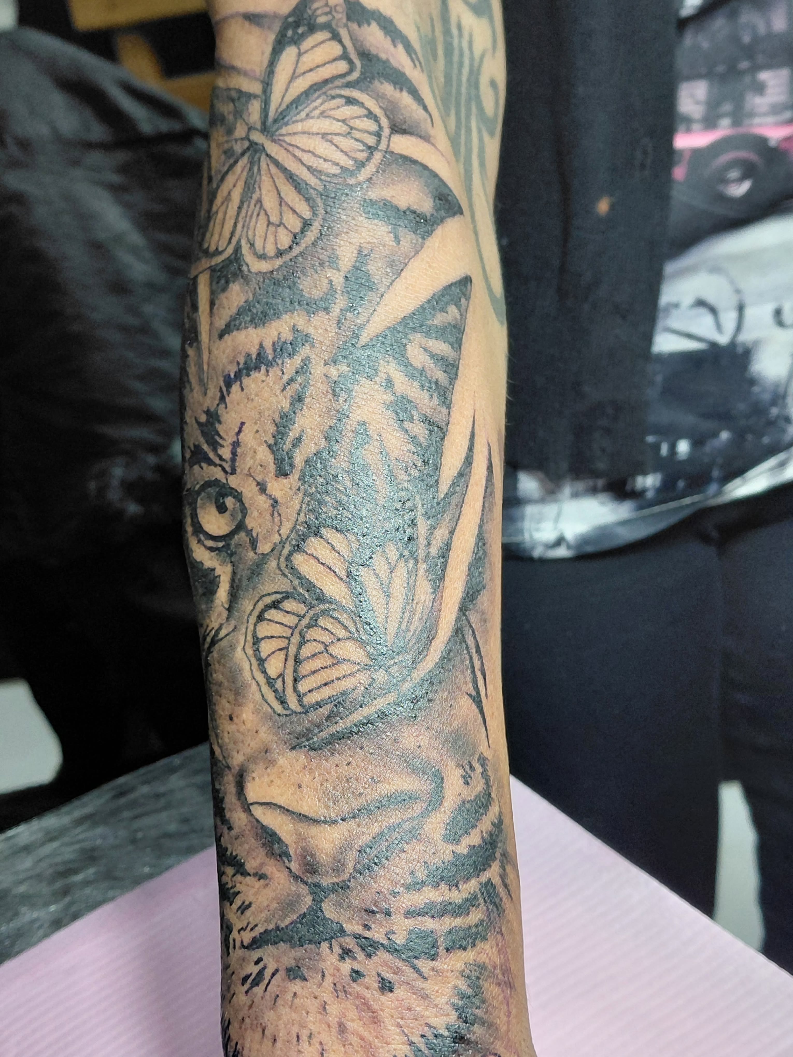 Tiger black and grey tattoo on the forearm by Jose Rodriguez