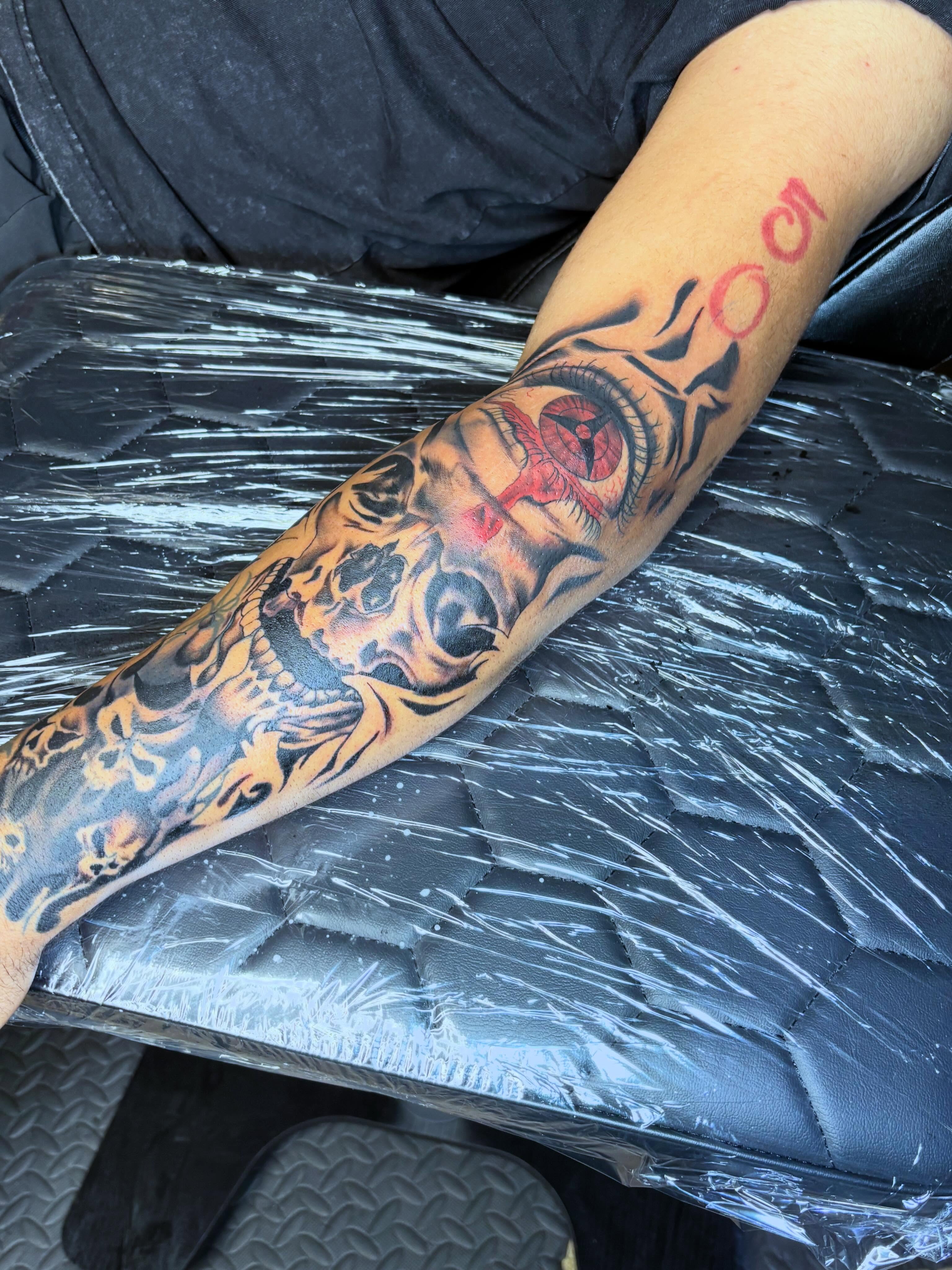 Skull and eye American traditional tattoo on the forearm by Mr.K