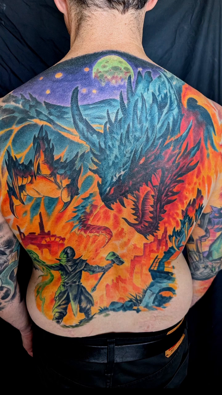 Dragon and warrior battle scene tattoo on the back by Nic Skrade, Minneapolis, Minnesota